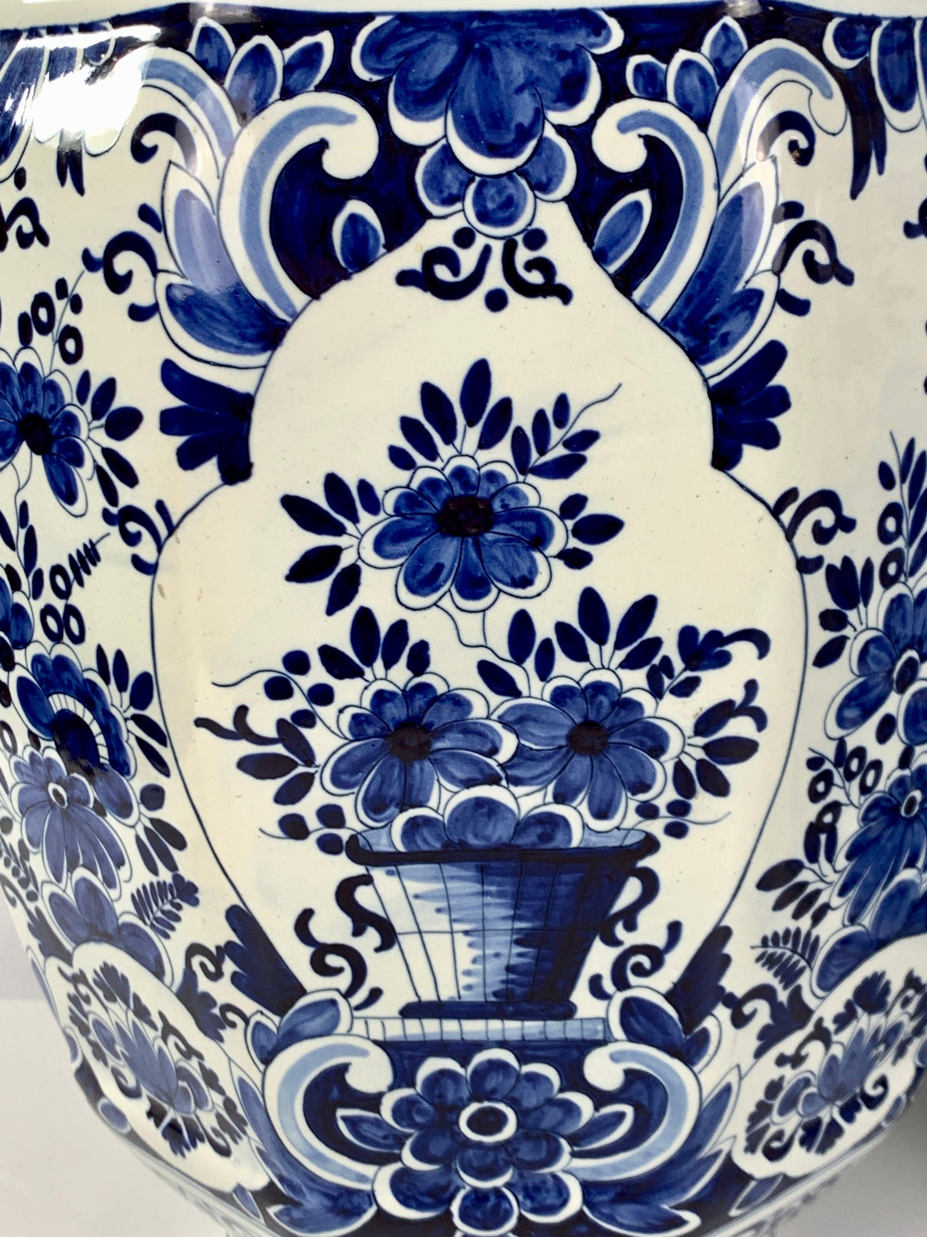 This pair of large Delft jars has a traditional blue flower decoration painted on a white tin-glaze ground.
Each jar is hand-painted, showing beautiful flowers.
The shoulders and cover were decorated in a traditional style with floral panels