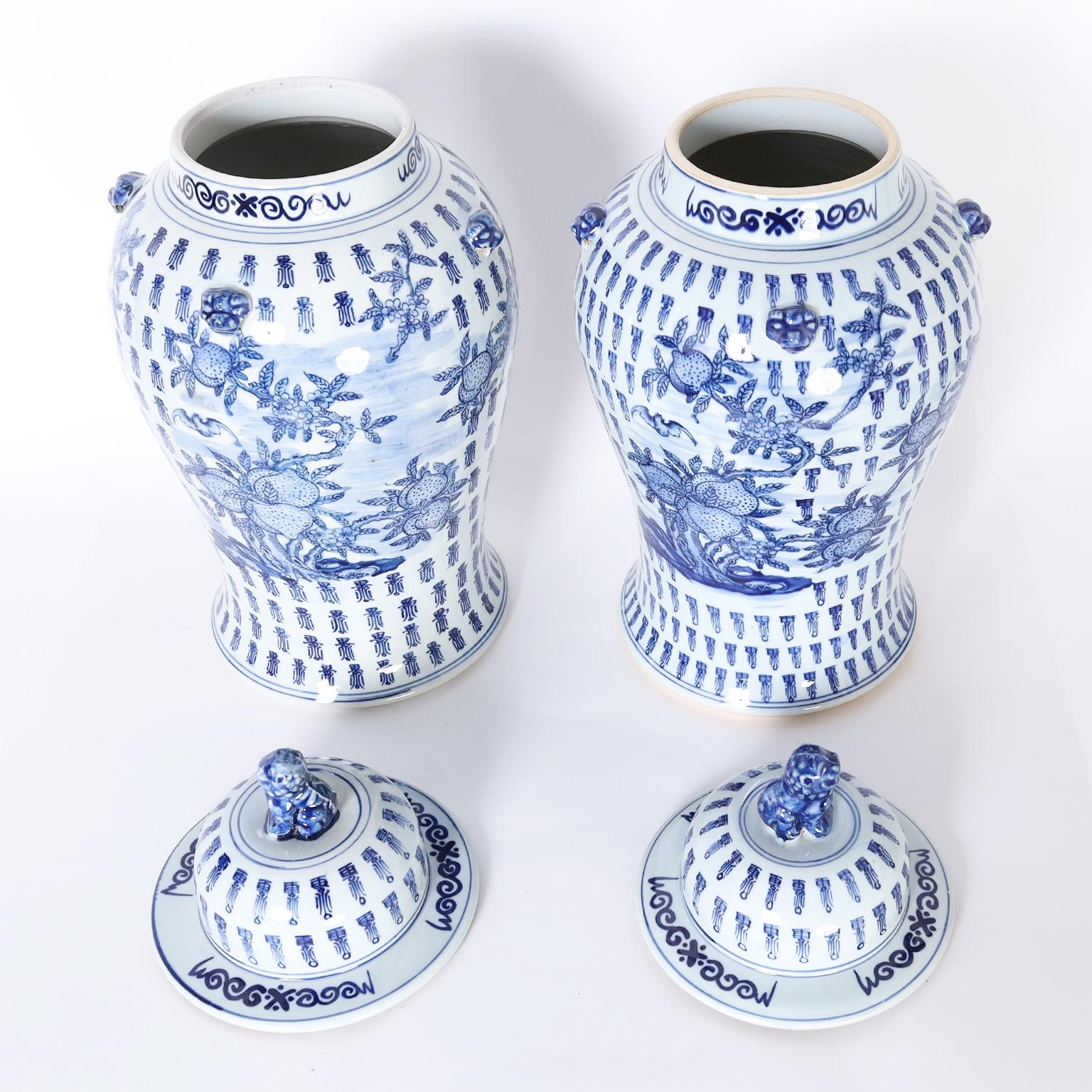 Chinese Export Pair of Large Blue and White Porcelain Lidded Urns or Jars For Sale