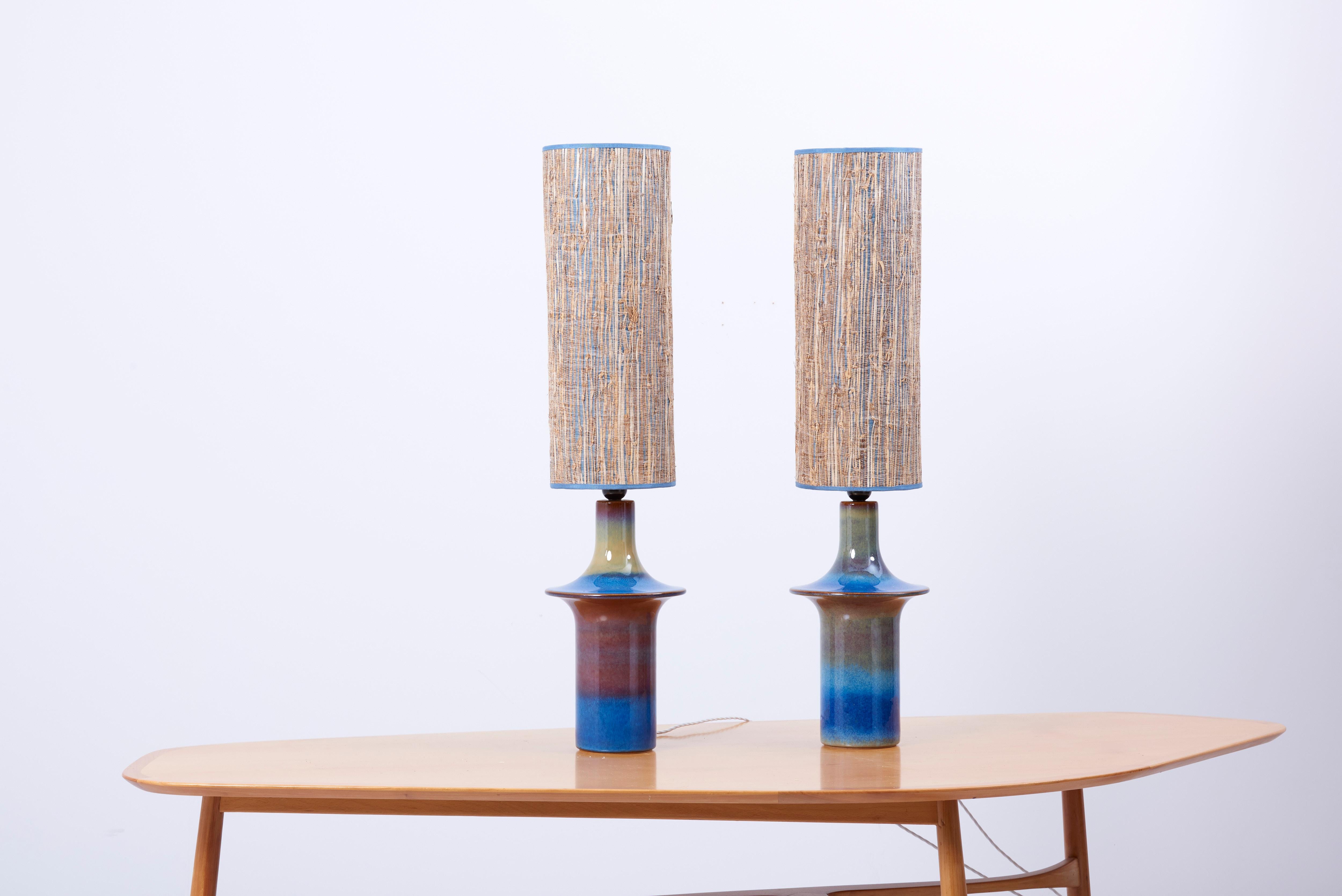 A pair of blue ceramic table lamps by Søholm Stentøj, Denmark. Marked by Søholm and in mint condition.
Including new custom lampshades curated by the Interior Designer Harry Clark.

1 x E27 socket / each.

Please note: Lamp should be fitted