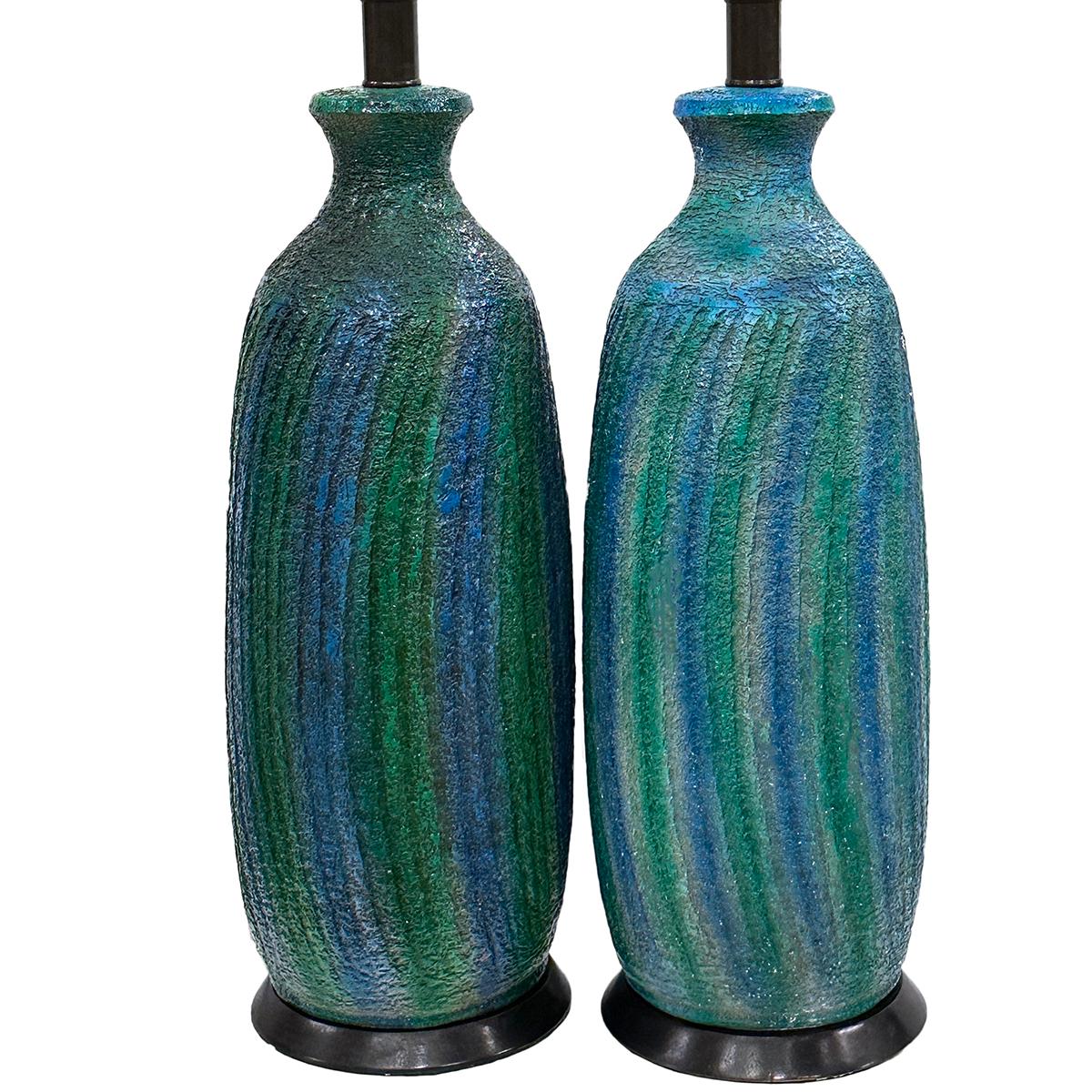 Pair of 1960's Italian lamps with blue shades.

Measurements:
Height of body: 22