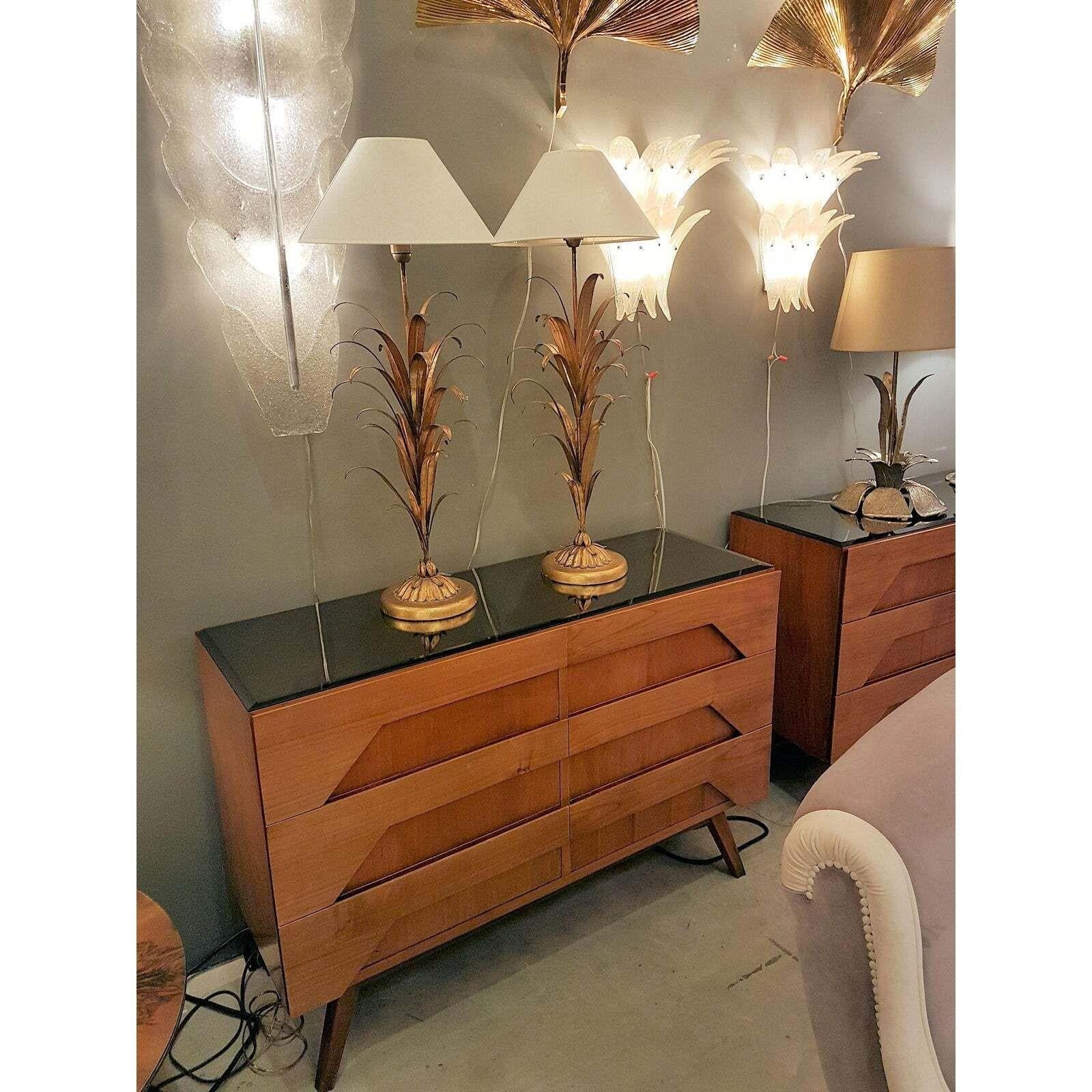 Pair of tall Mid-Century Modern wheat leaf bouquet table lamps, in the style of Coco Chanel, France circa 1940.
The vintage lamps are made of gilt metal.
The pair of table lamps has 1 light each and is rewired for the US: with a Medium base bulb, or