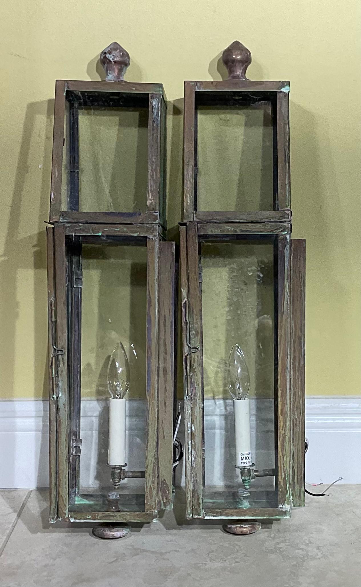Pair of wall lantern or wall sconces, made of solid copper and brass ,beautiful patina , decorative top and bottom , one 60/watt lights each lantern,
Suitable for wet locations, UL approve, up to US code.
Great looking wall lanterns for any