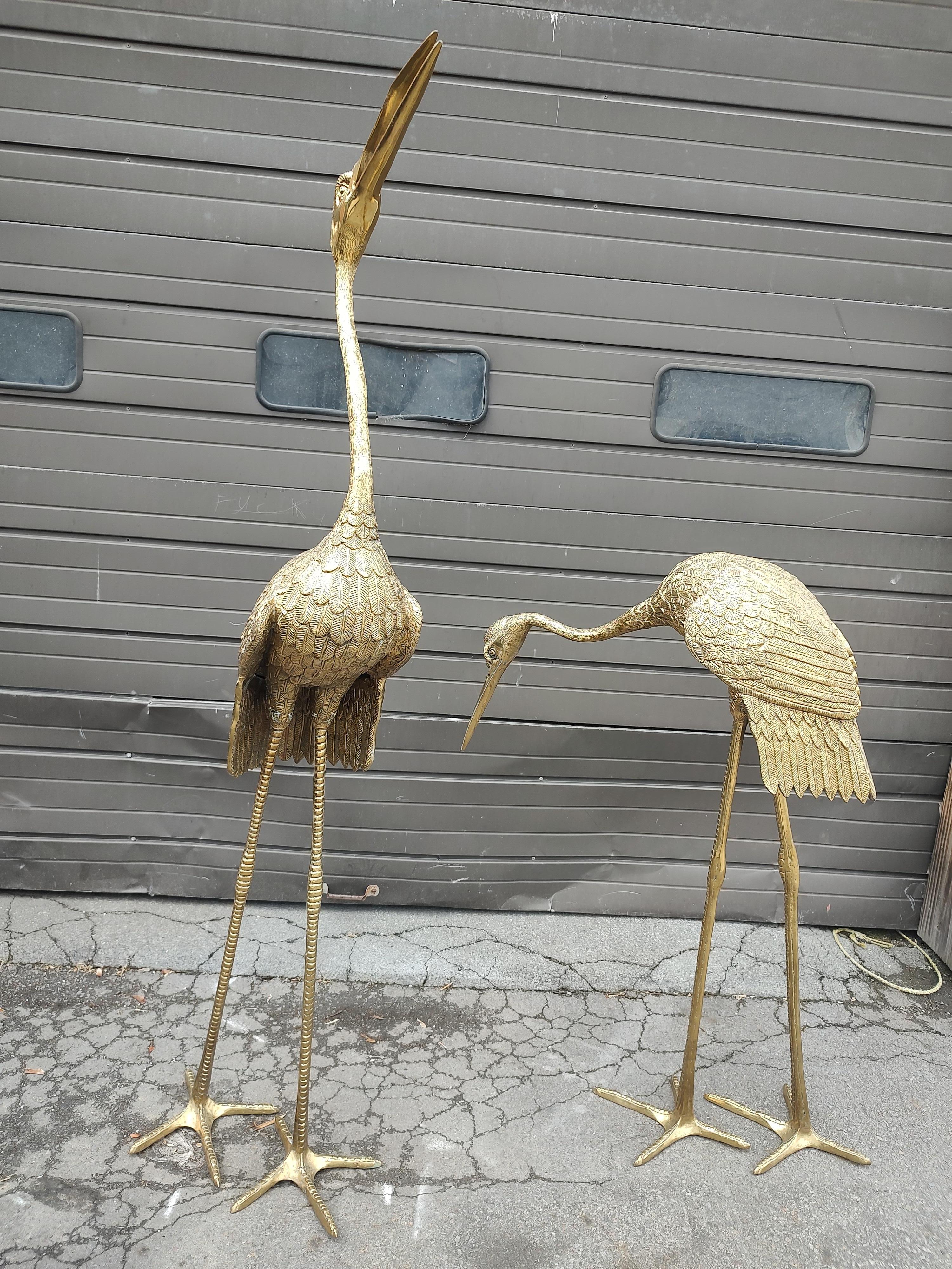 Spectacular pair of large Mid Century Modern Hollywood Regency brass egrets / cranes. Tall bird is 80 inches high, smaller bird is 50h x 38d x 11w
In amazing polished condition as these were kept inside the home. Will make a fabulous addition to the