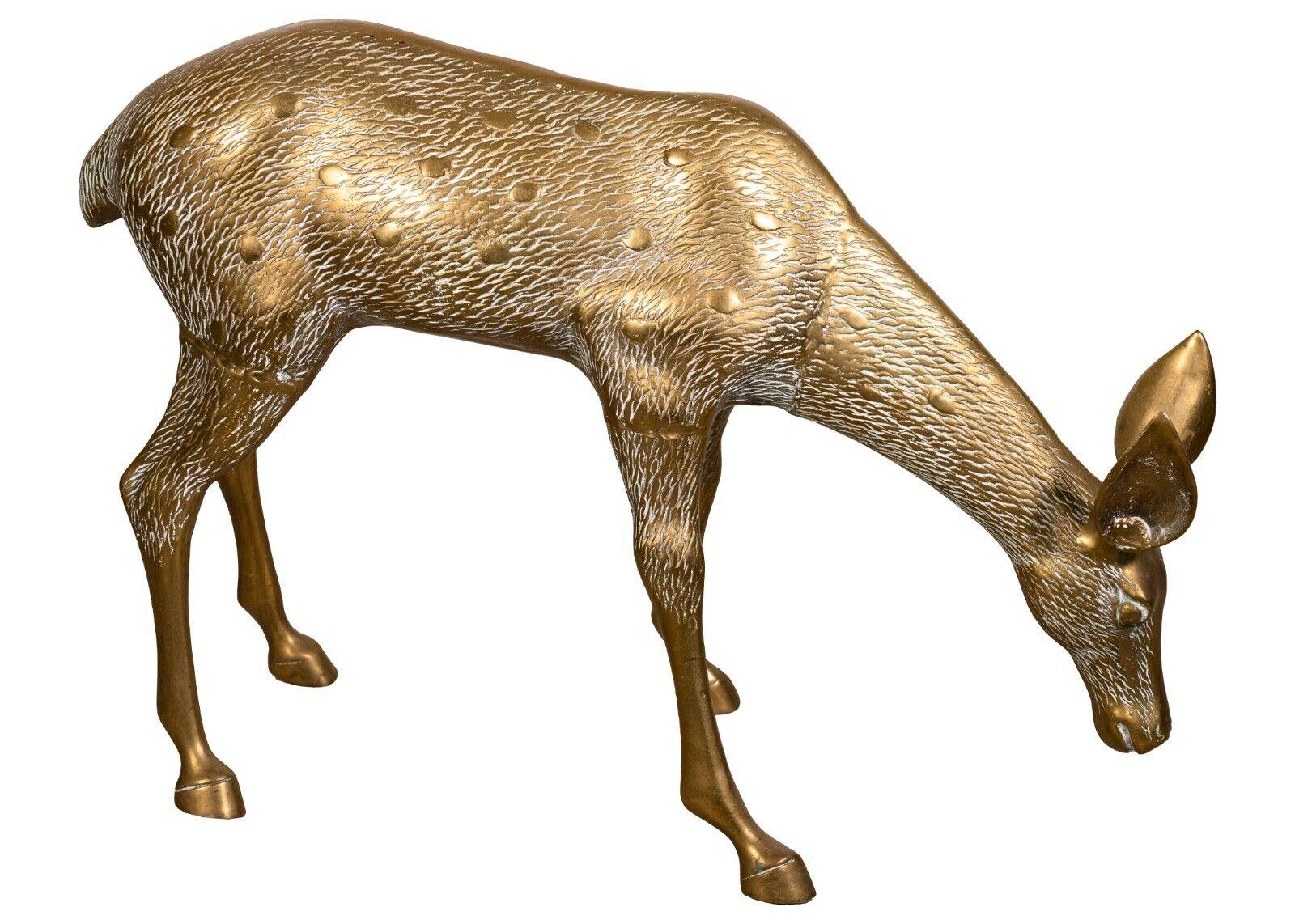 A large pair of brass deer sculptures, buck & doe. This lively pair of sculptures have been very skillfully created for a very dynamic viewing experience. Their positions look as if they are actively moving in space. They look fantastic as a pair.