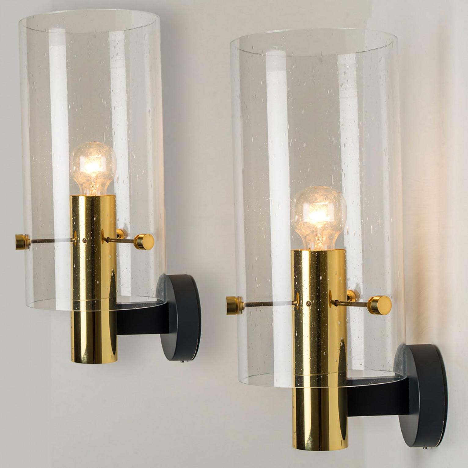 Pair of Brass & Glass Wall Lights by Glashütte Limburg, 1970s.

Please note the price is for a pair of two pieces.

Cleaned and well-wired, in full working order and ready to use. The frame is in very good condition. The fixture requires 1 E27