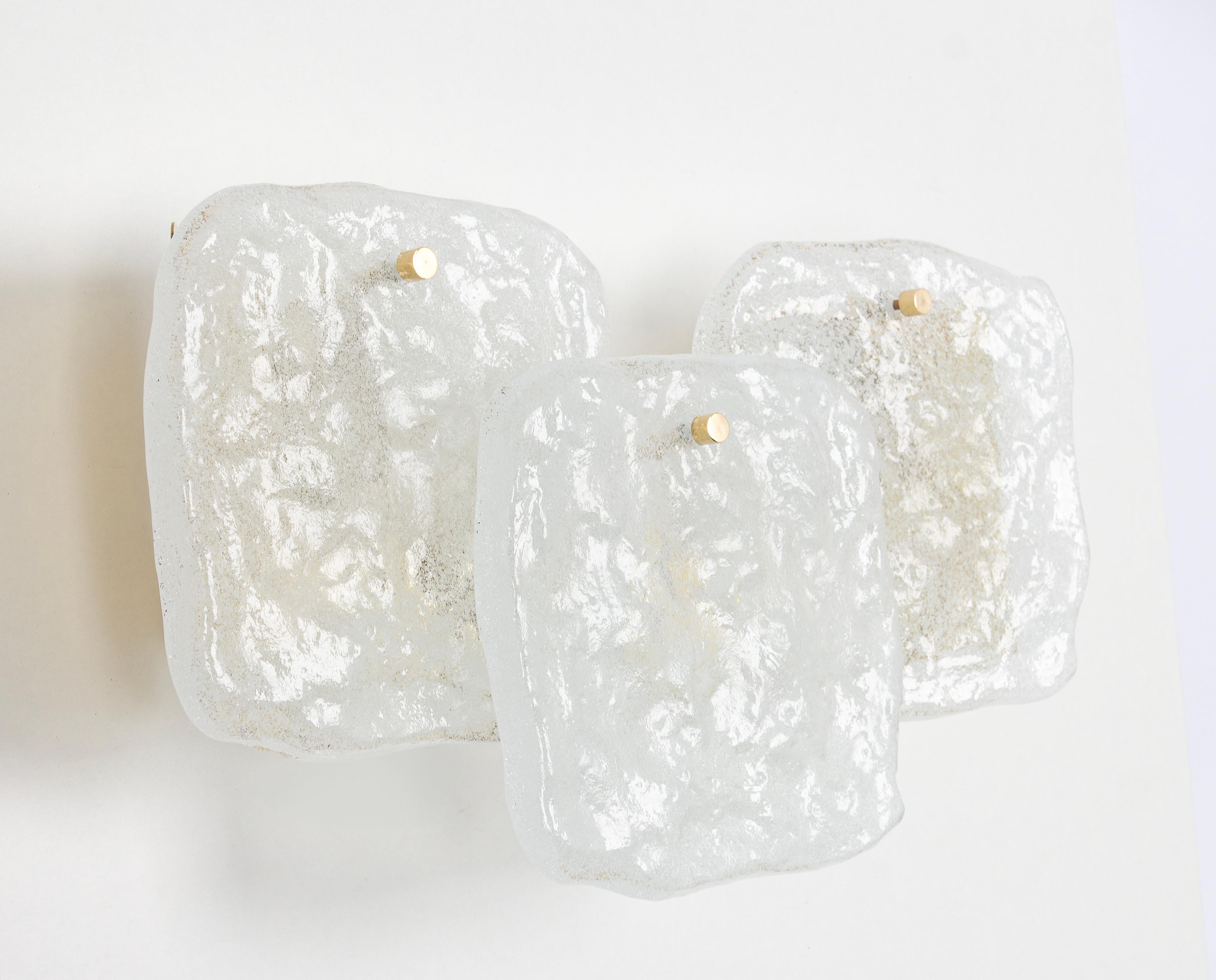 Fantastic midcentury wall sconces with 3 large Murano glass pieces on a brass frame, made by Kalmar, Austria, manufactured, circa 1960-1969.
Great geometrical shape. 
Each sconce needs three x E14 small bulbs.
Light bulbs are not included. It is