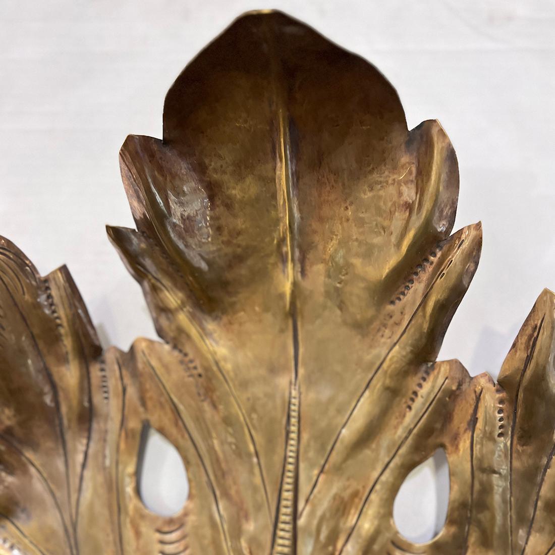 Pair of Italian circa 1950's Repoussé brass sconces, original patina.

Measurements:
Height:23