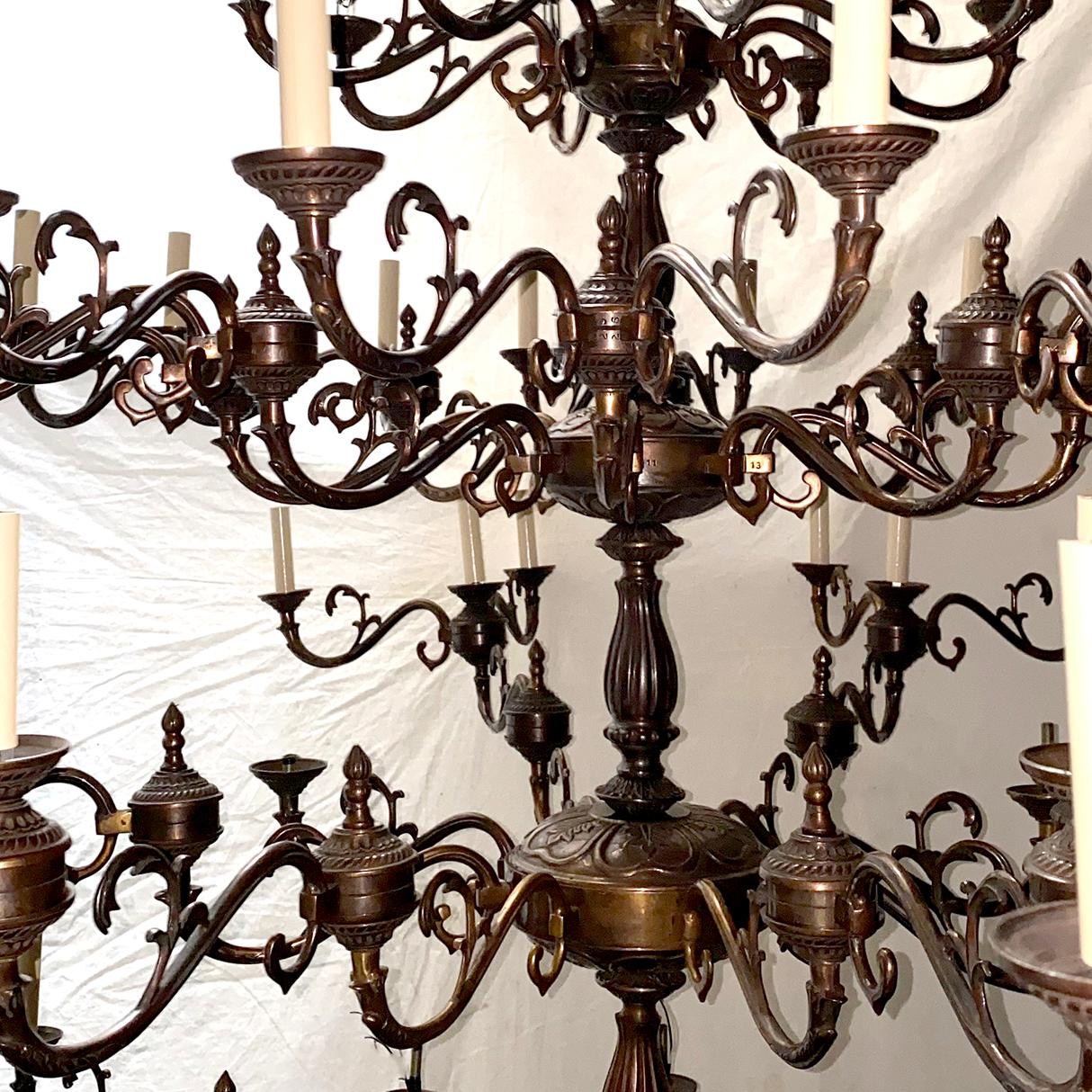Patinated Pair of Large Bronze Chandeliers, sold individually  For Sale