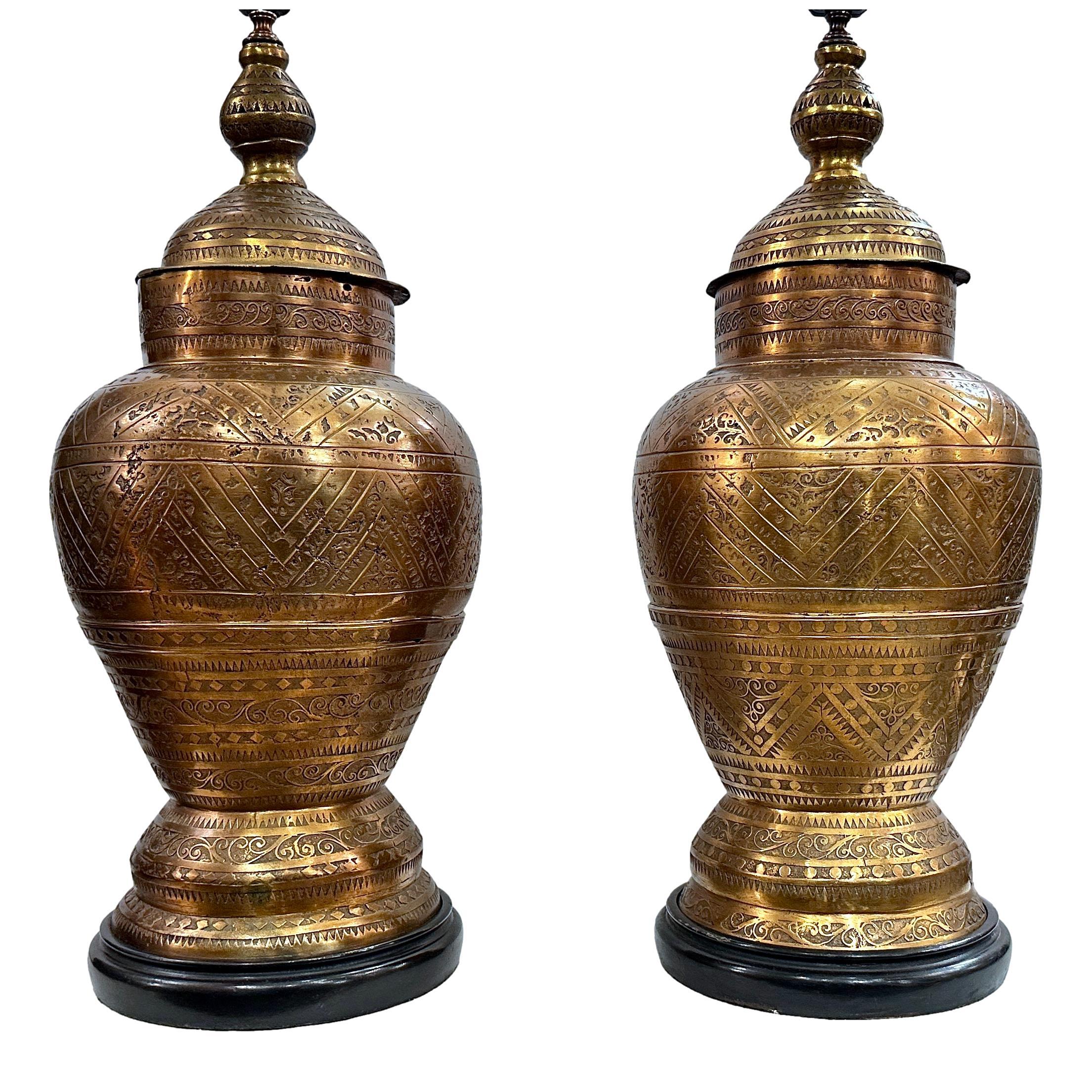 Pair of circa 1960's Moroccan etched and cast bronze lamps with original patina. 

Measurements:
Height of body: 27