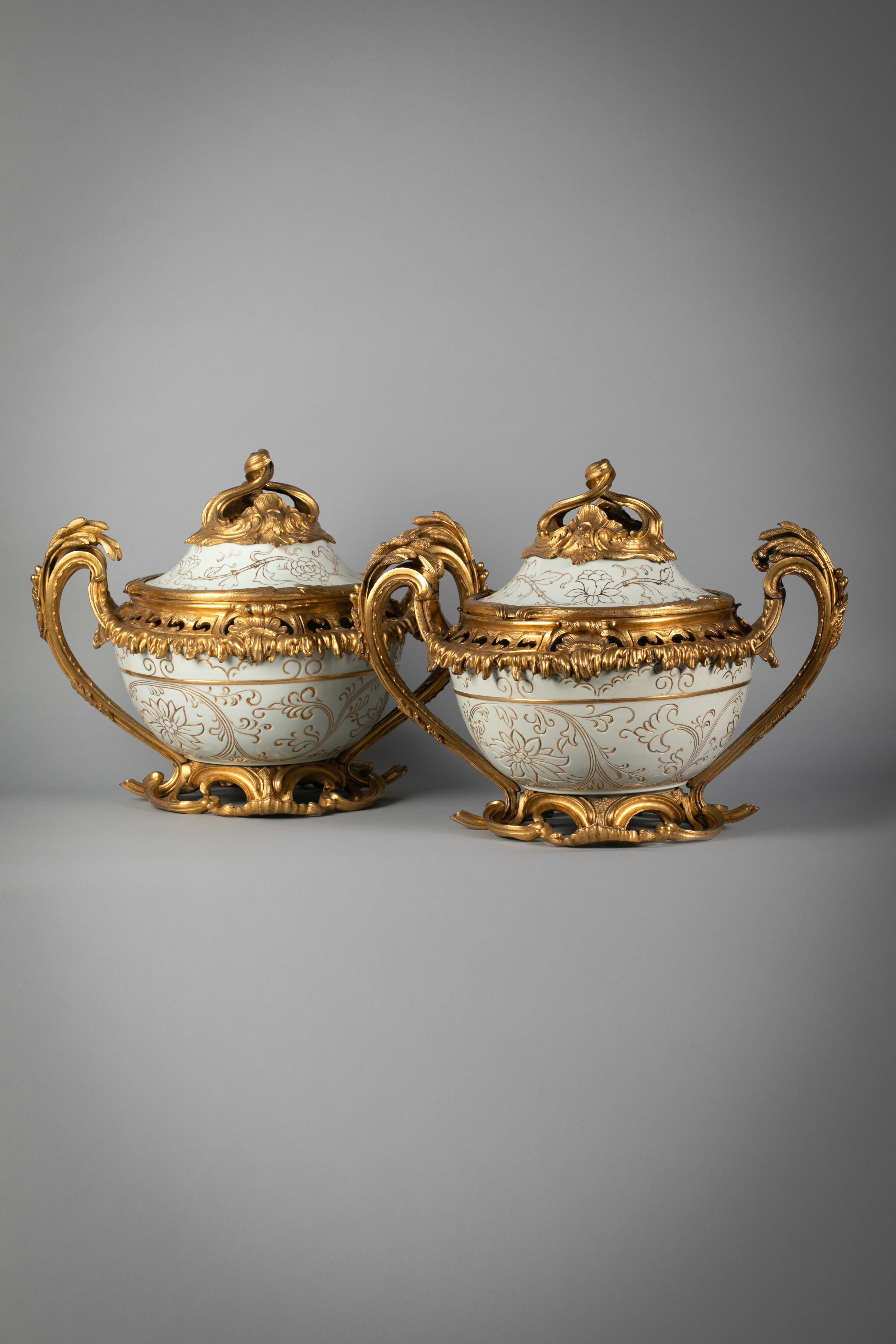 Pair of large bronze-mounted celadon and gilt covered potpourri jars, circa 1870 on French mounts.