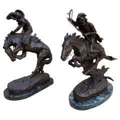 Pair of Large Bronze Table Sculptures with Marble after Frederic Remington
