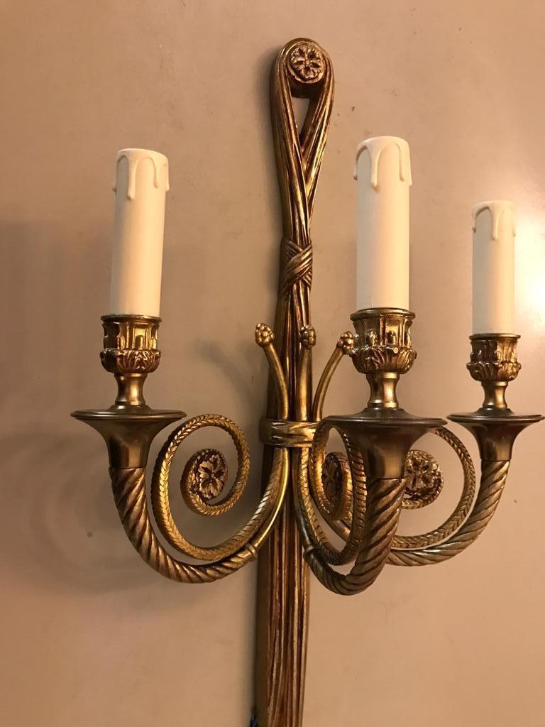Hollywood Regency Pair of large bronze wall lights. Italy 1940s. For Sale