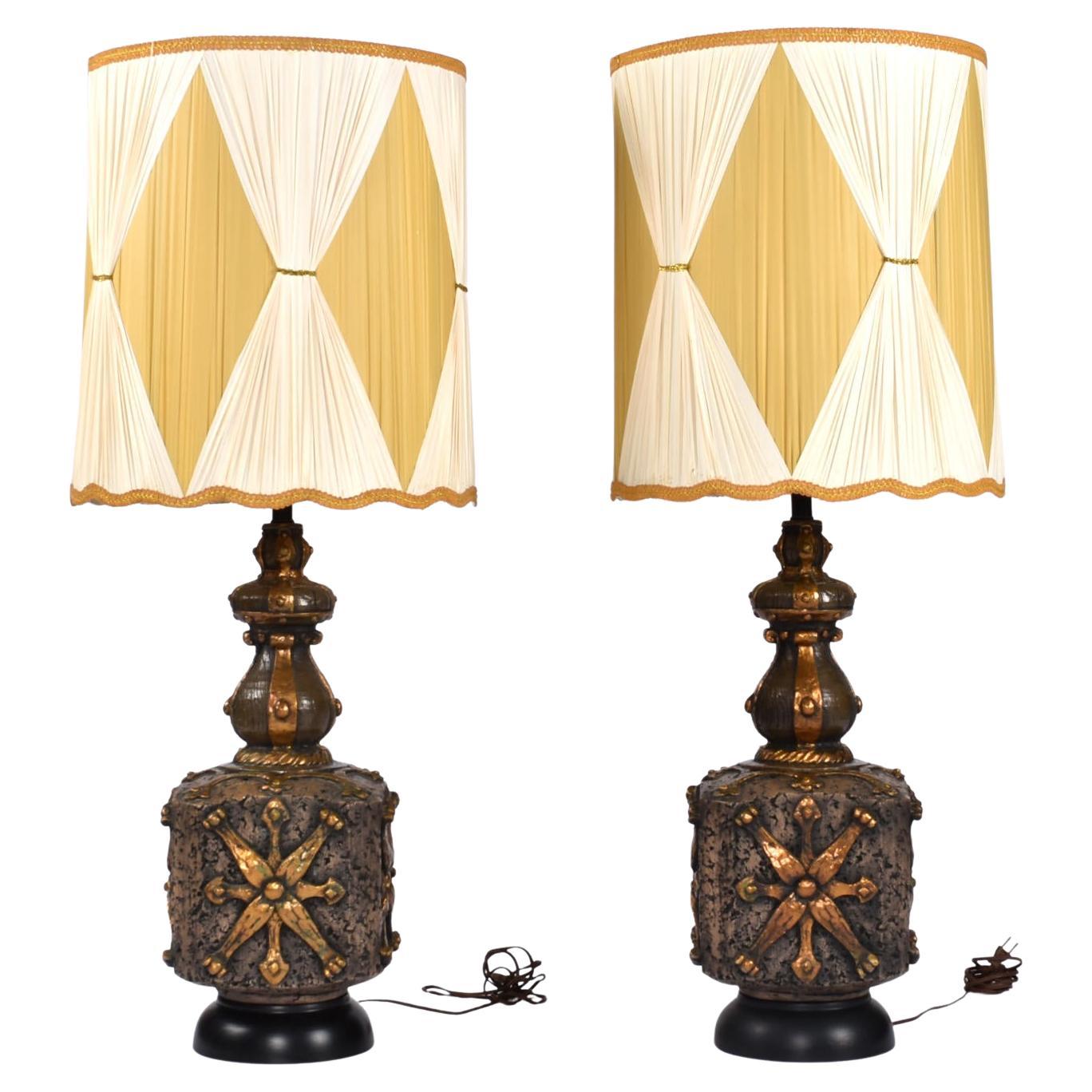 Pair of outstanding vintage over-sized Brutalist lamps. If you’re looking to make a statement, look no more. These exceptional lamps are larger than life with their pleated, draped shades and richly textured surfaces. Bold is the operative word. The