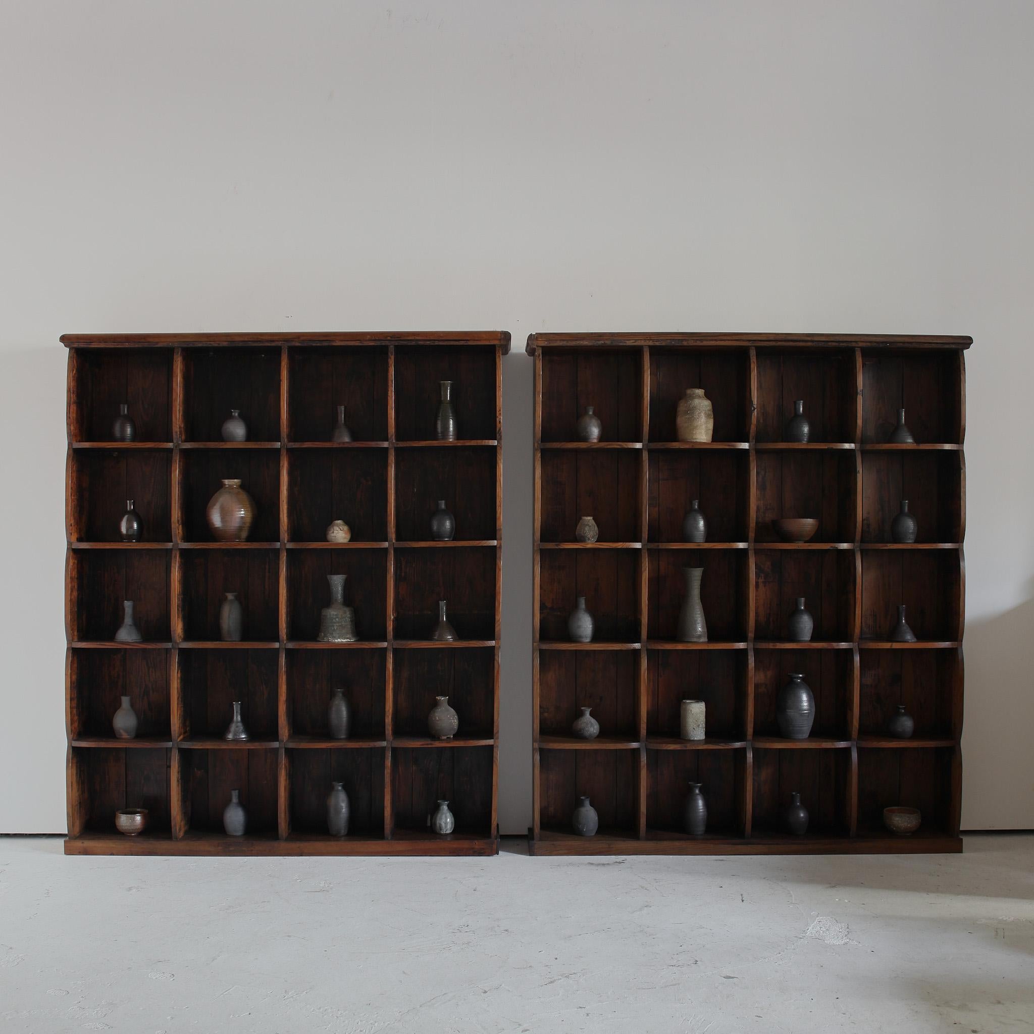 A pair of large scale solid pine C.1940s shelving units from Northern Portugal.

 

Heavily patinated with unusual scalloped shelf construction.

 

Each compartment measures roughly 33cm H, 35.5cm W, 23cm D