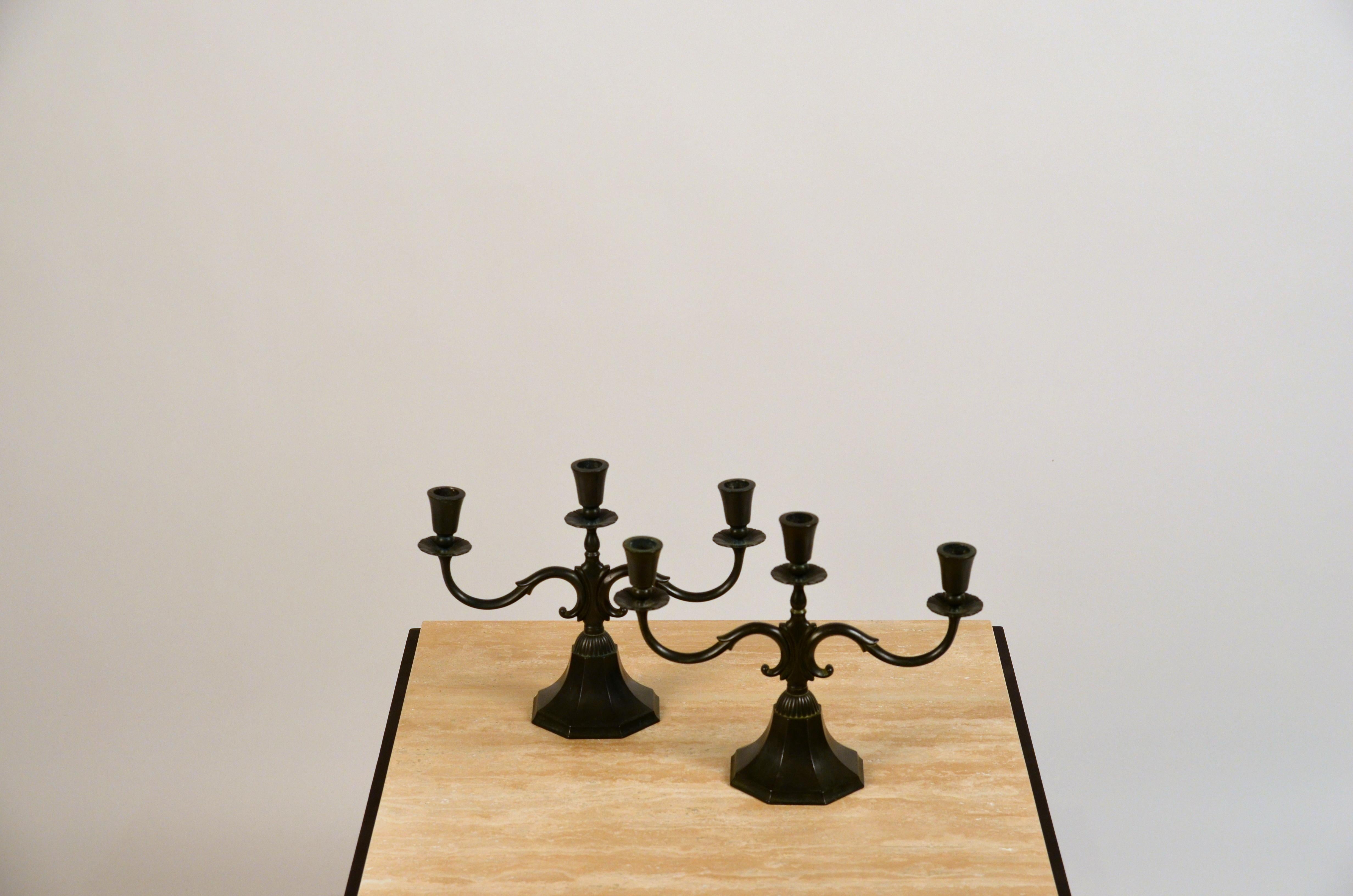 Pair of large candelabra in disko metal by Just Andersen. Made during the 1930s in his workshop in Copenhagen.

This design is model 155 and features an octagonal base and 3 arms.

It is stamped and numbered JUST and 155 DANMARK inside the