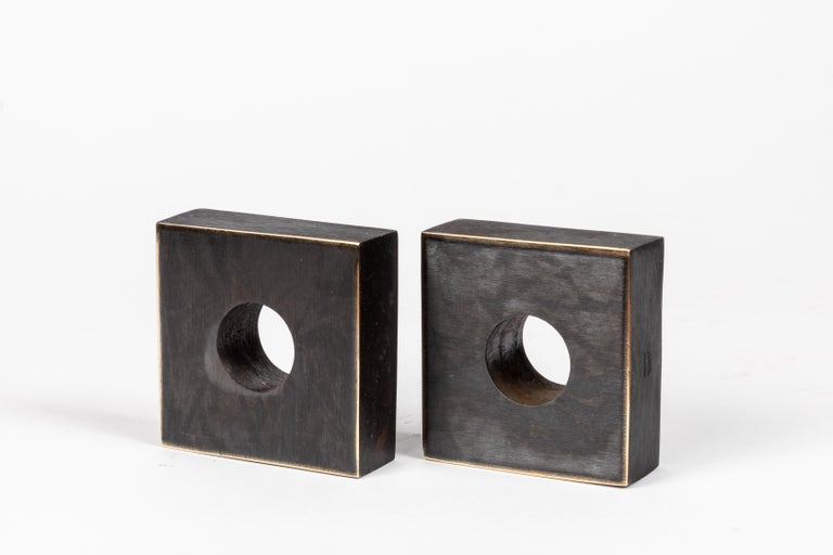 Pair of Carl Aubo¨ck Model #4575 Patinated Brass Bookends. Designed in the 1950s, this incredibly refined and sculptural pair of bookends are executed in patinated brass. 

Produced by Carl Auböck IV in the original Auböck Werkstätte in the 7th