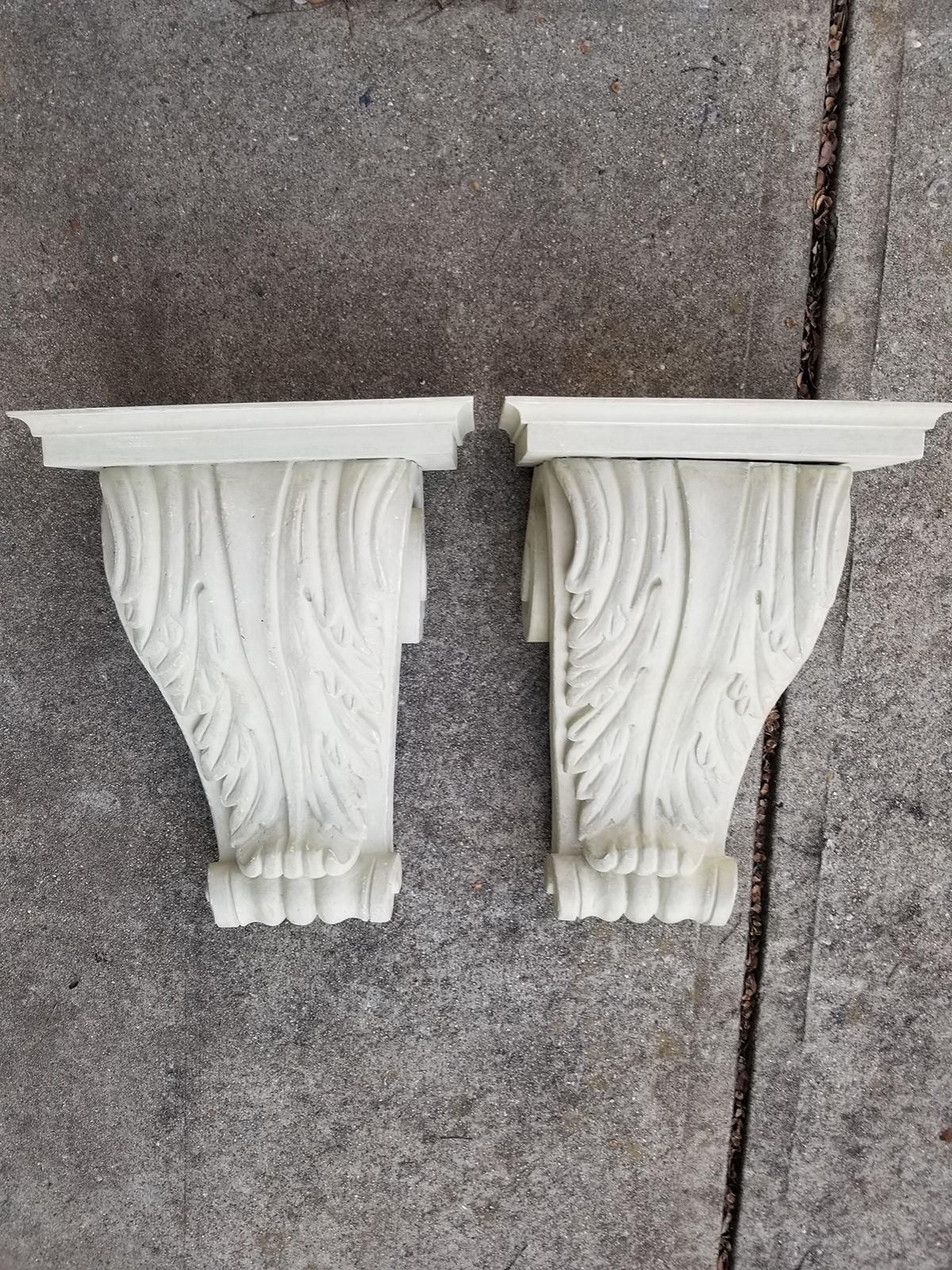 Pair of large carved 20th century wood brackets.