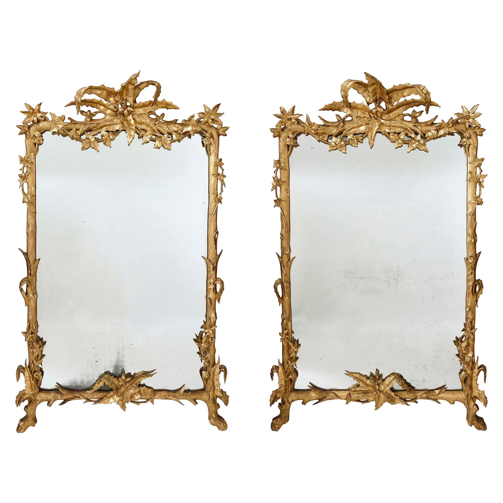 Pair of Large Carved and Gilt Wood Floral Mirrors For Sale