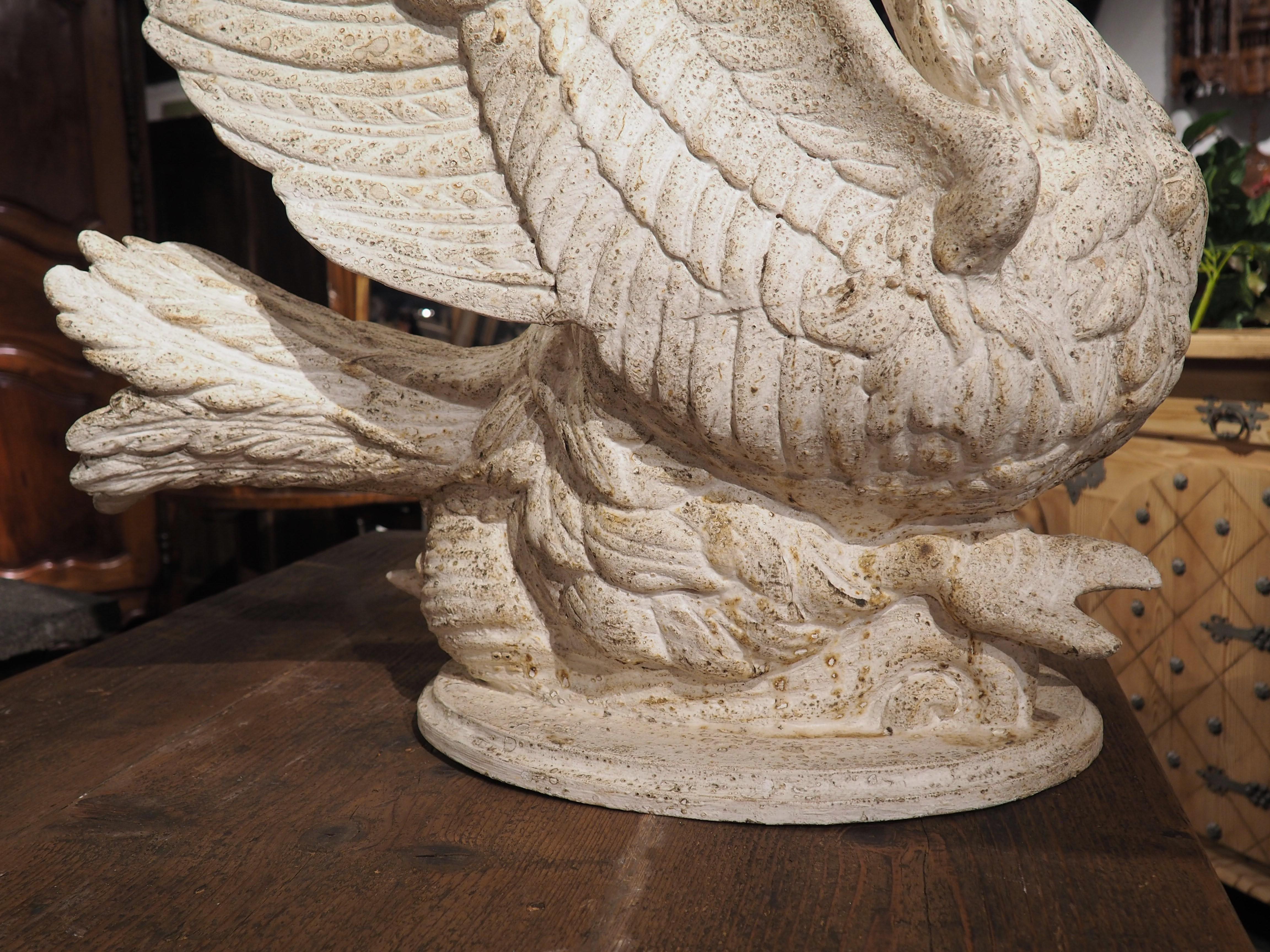 Hand-carved in Italy, this fantastic pair of large carved and white painted wooden swan planters are every bit as graceful as the actual bird they depict. Based on the curved neck and downward pointing bill, this is most likely a mute swan, which is