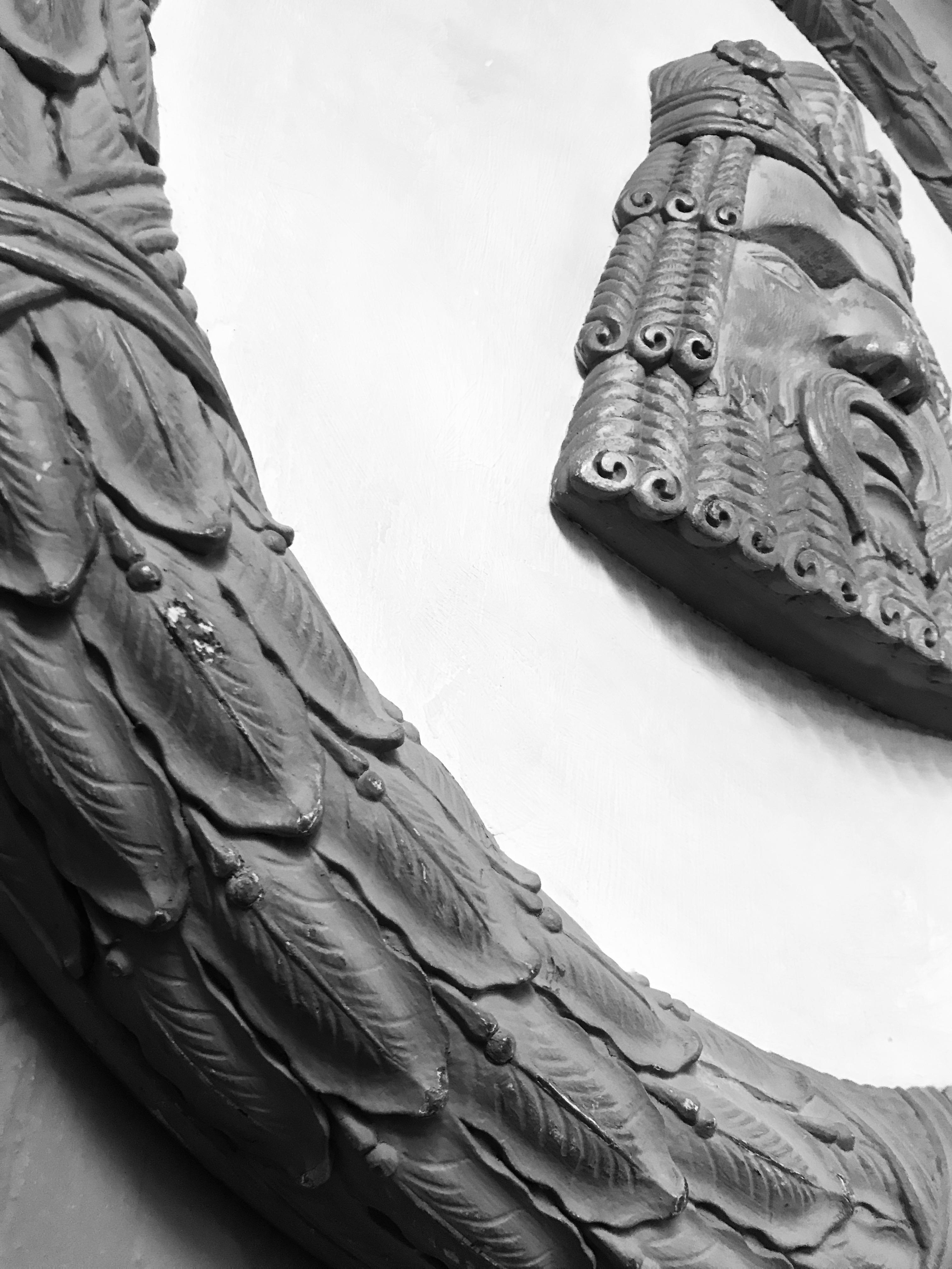 A pair of large English country house roundels or wall plaques in the early 18th century manner. Of carved and painted mahogany, with laurel wreath and classical mask 3.

 