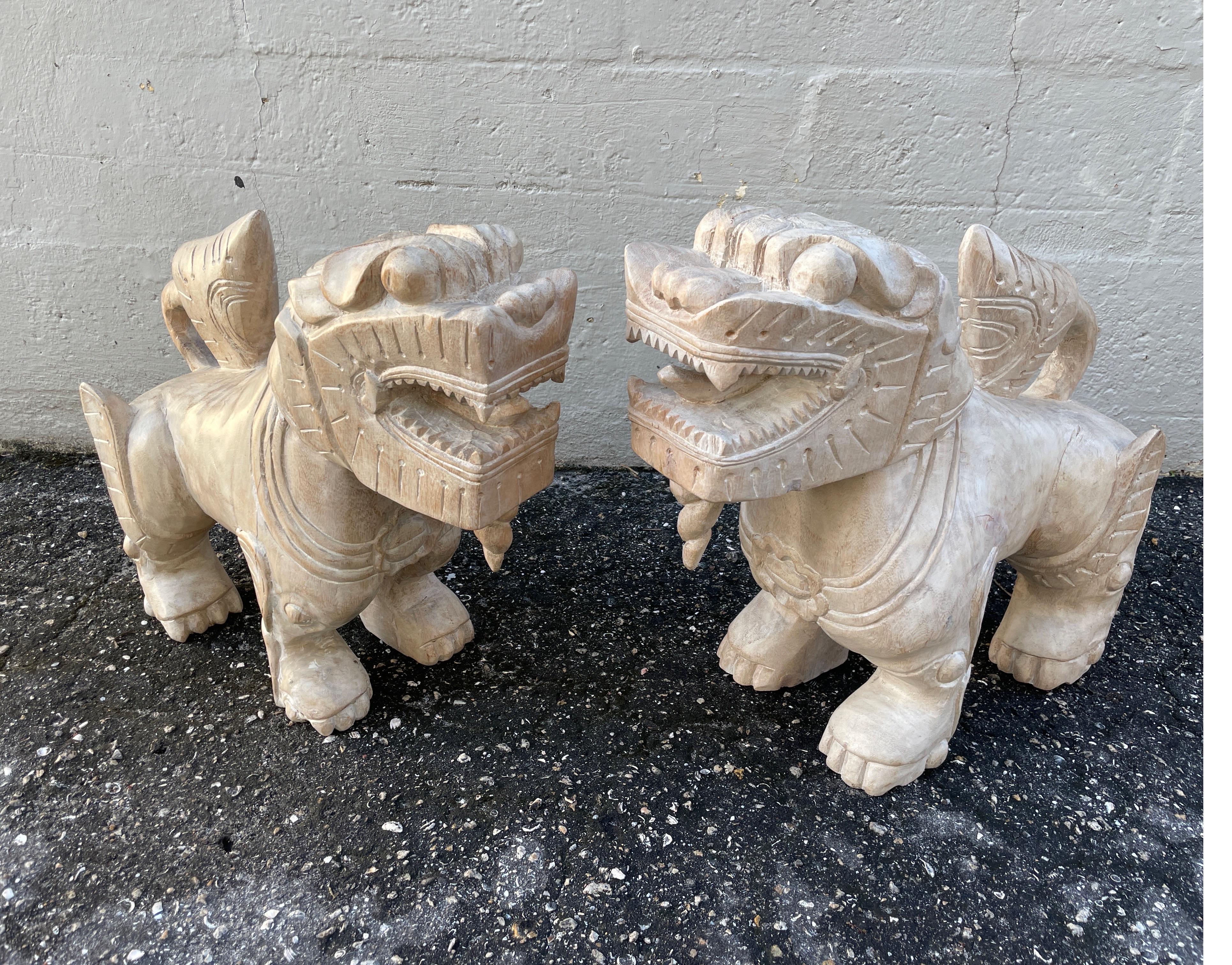 Pair of large & impressive carved Chinese foo dogs.