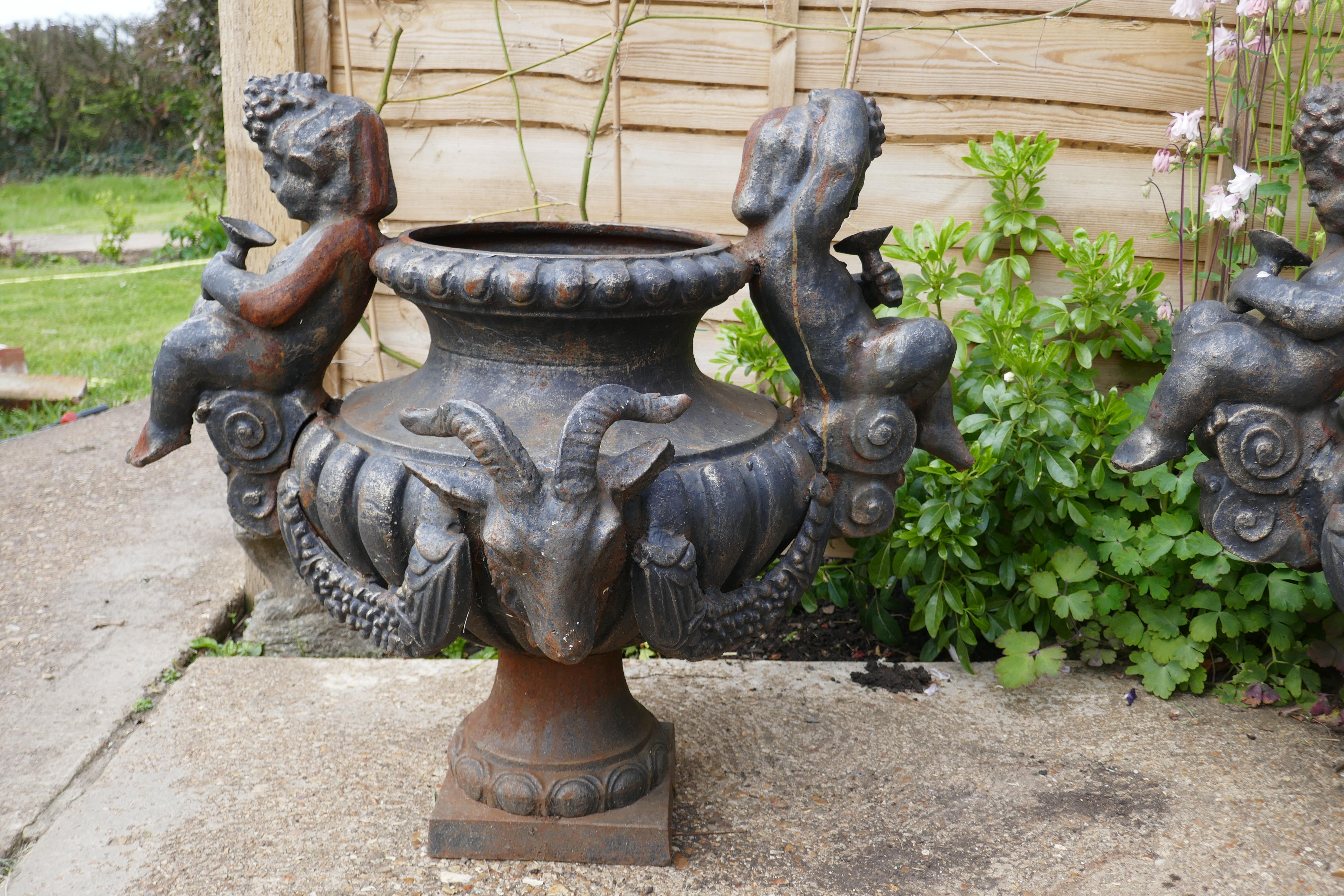 Pair of Large Cast Iron Garden Urns with Rams and Putti In Good Condition For Sale In Chillerton, Isle of Wight