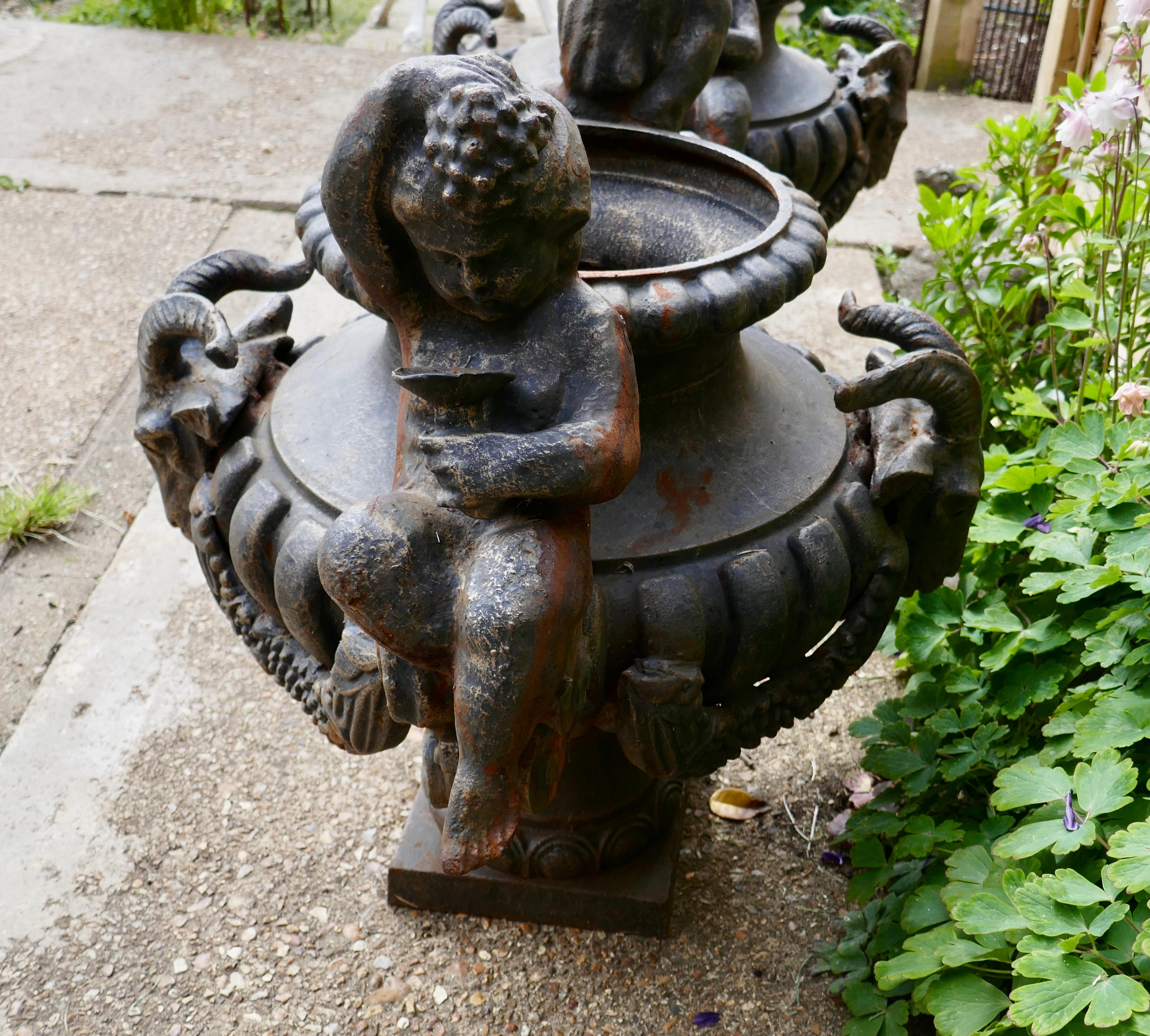 Pair of Large Cast Iron Garden Urns with Rams and Putti For Sale 3