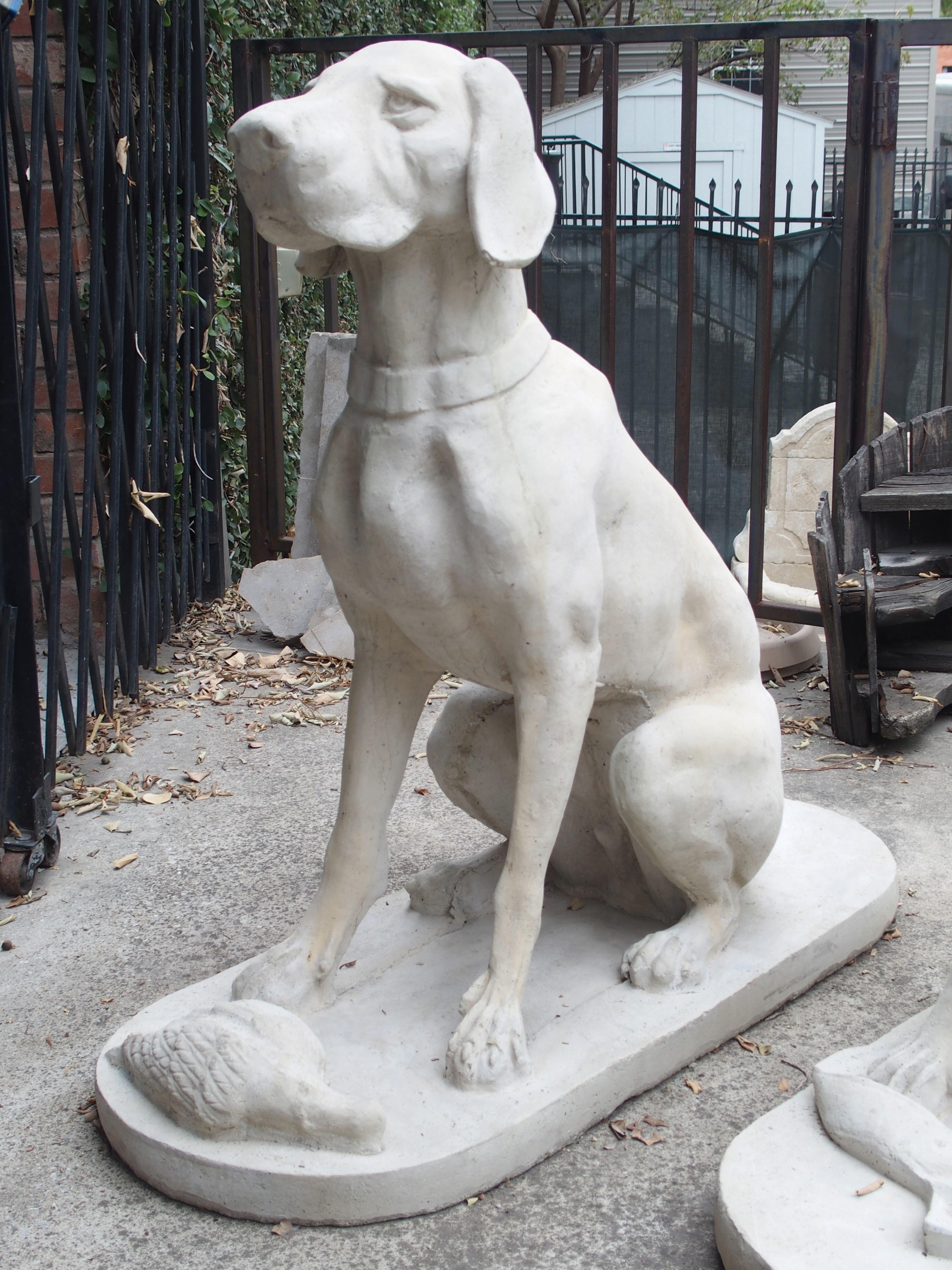 This pair of cast stone hunting dogs is based on an original 19th century iron sculpture. The original would have been done by a French “Animalier”, which was an artist that specialized in painting or sculpting realistic portrayals of