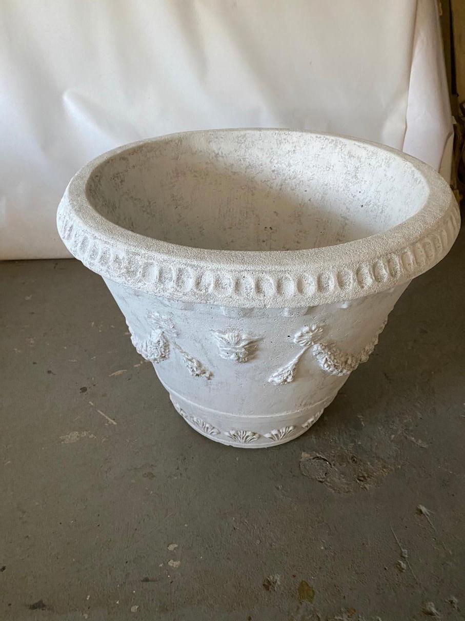 Pair of impressive white washed cast stone neoclassical style garden pots or planter with swag design. Will make a wonderful presence in any garden, yard or outdoor space. Garden urns, planters, jardinières.