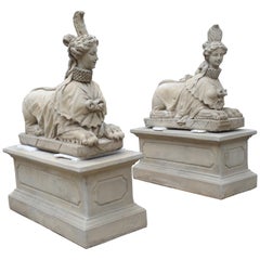 Pair of Large Cast Stone Sphinxes on Pedestal Bases
