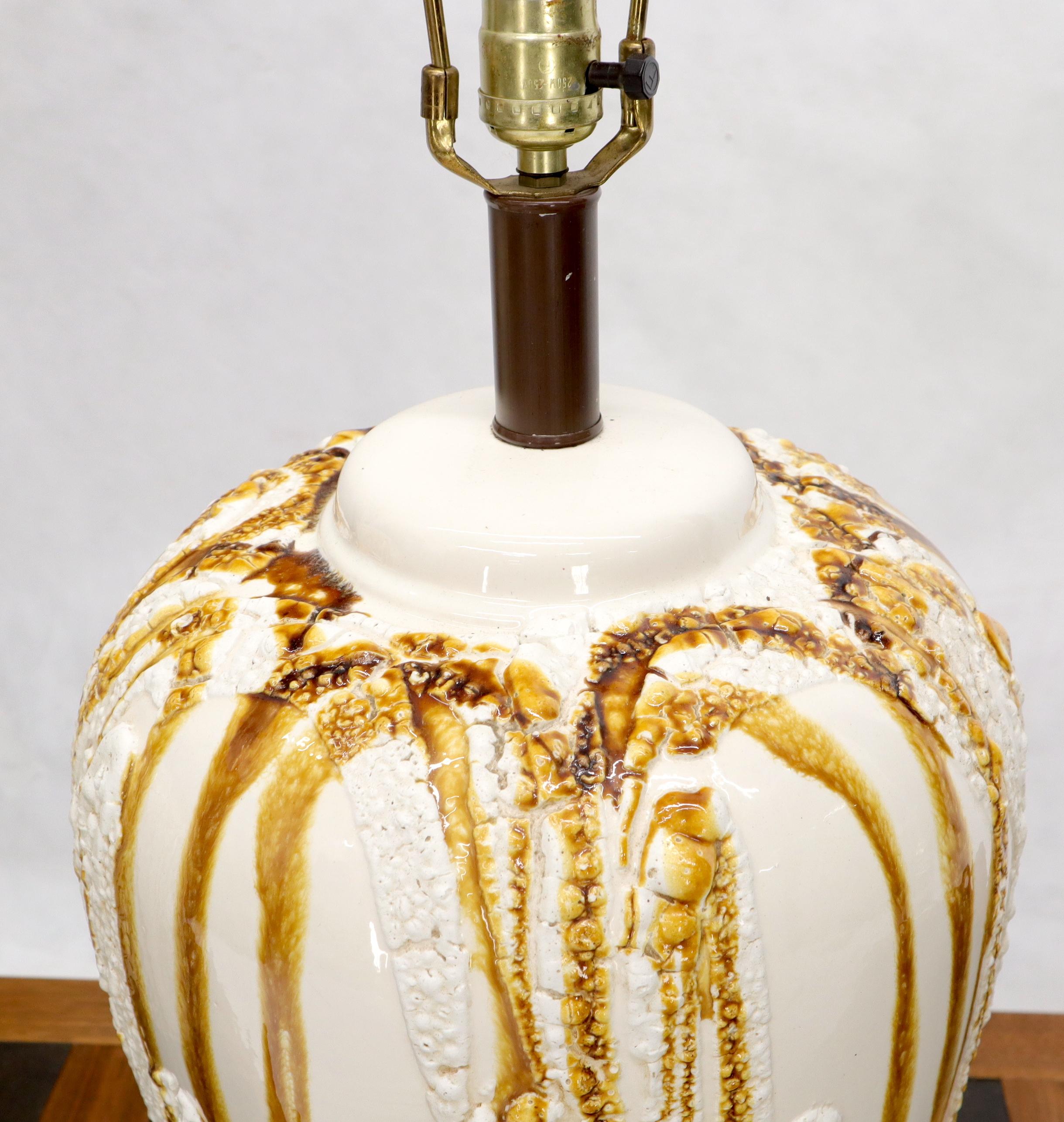 Pair of Mid-Century Modern large ceramic vase shape glazed table lamps.