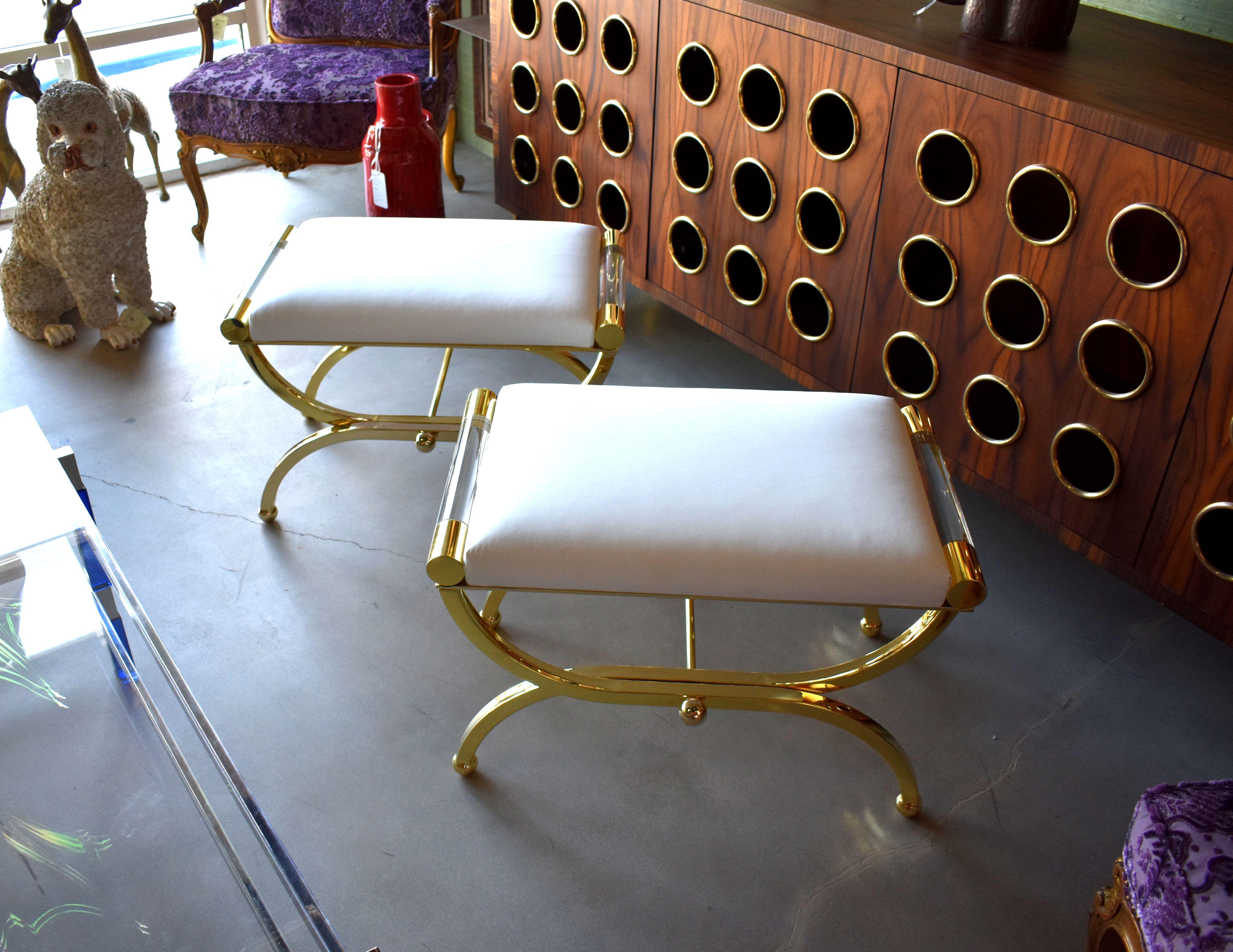 A pair of Regency benches design and signed by Charles Hollis Jones. Each bench is made of brass and Lucite with a faux white leather cushion.

Provenance directly from CHJ.

About Charles Hollis Jones:

Charles Hollis Jones is an American artist
