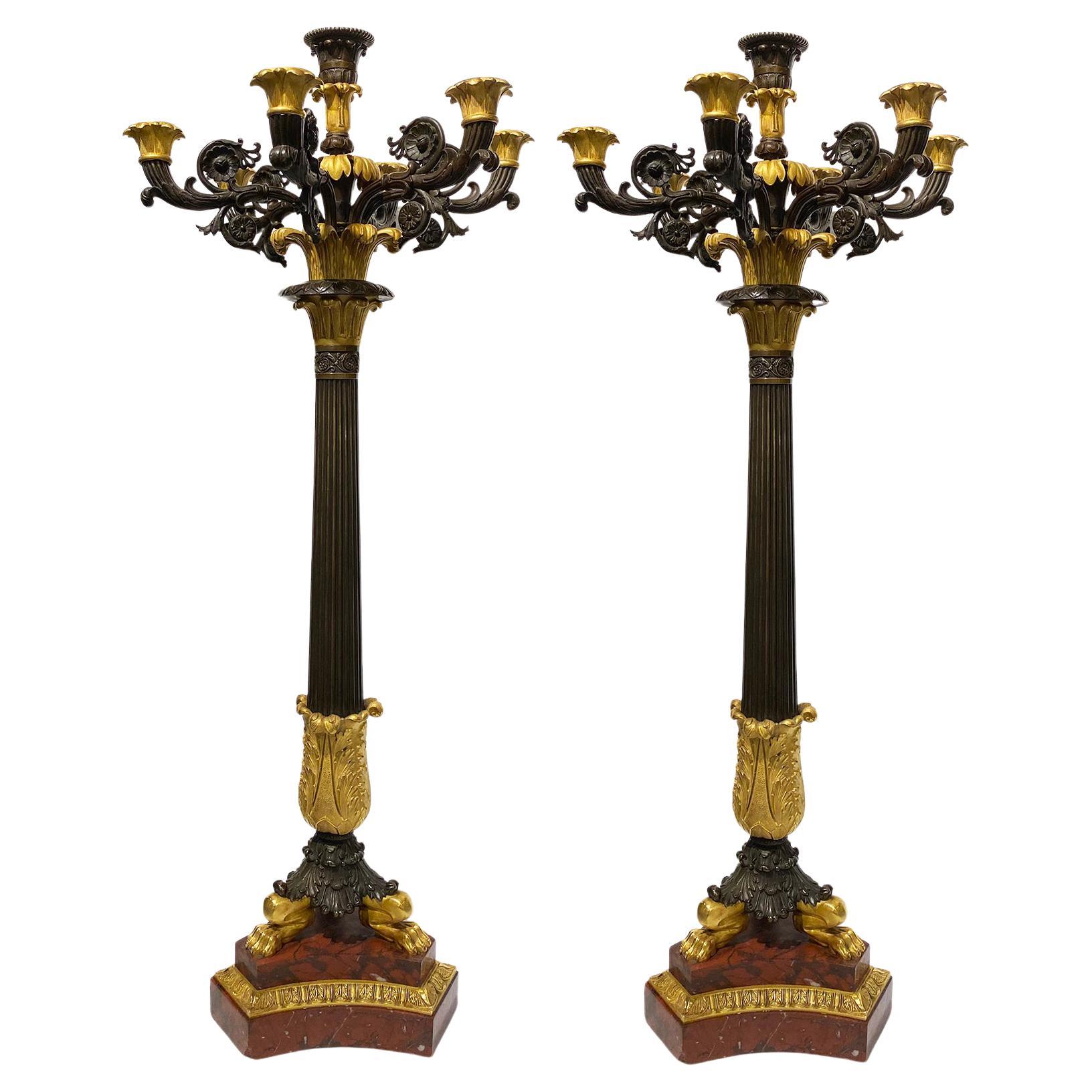 Paire de grands candélabres Charles X en bronze doré et bronze patiné en vente