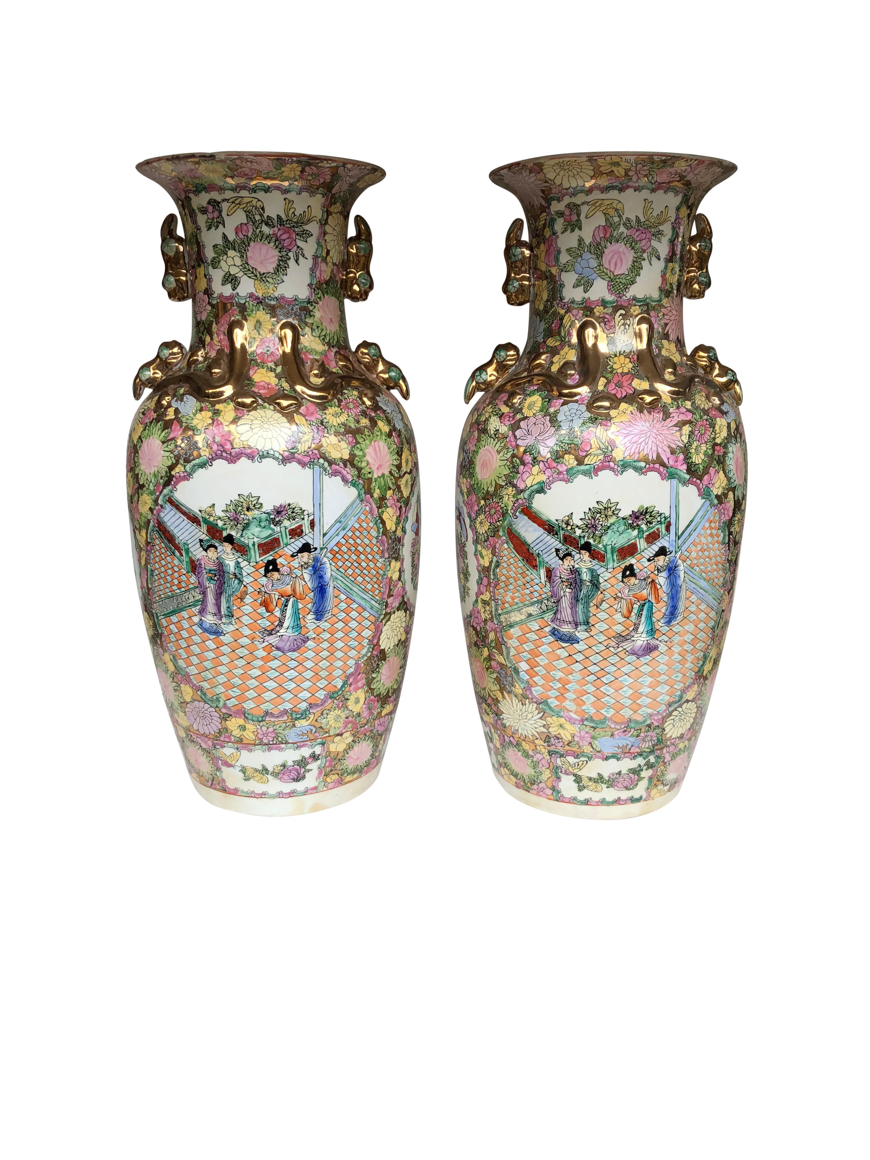 A pair of large China vases, 20th century. Detailed with matching garden scenes and floral decorations. Offered in excellent condition.