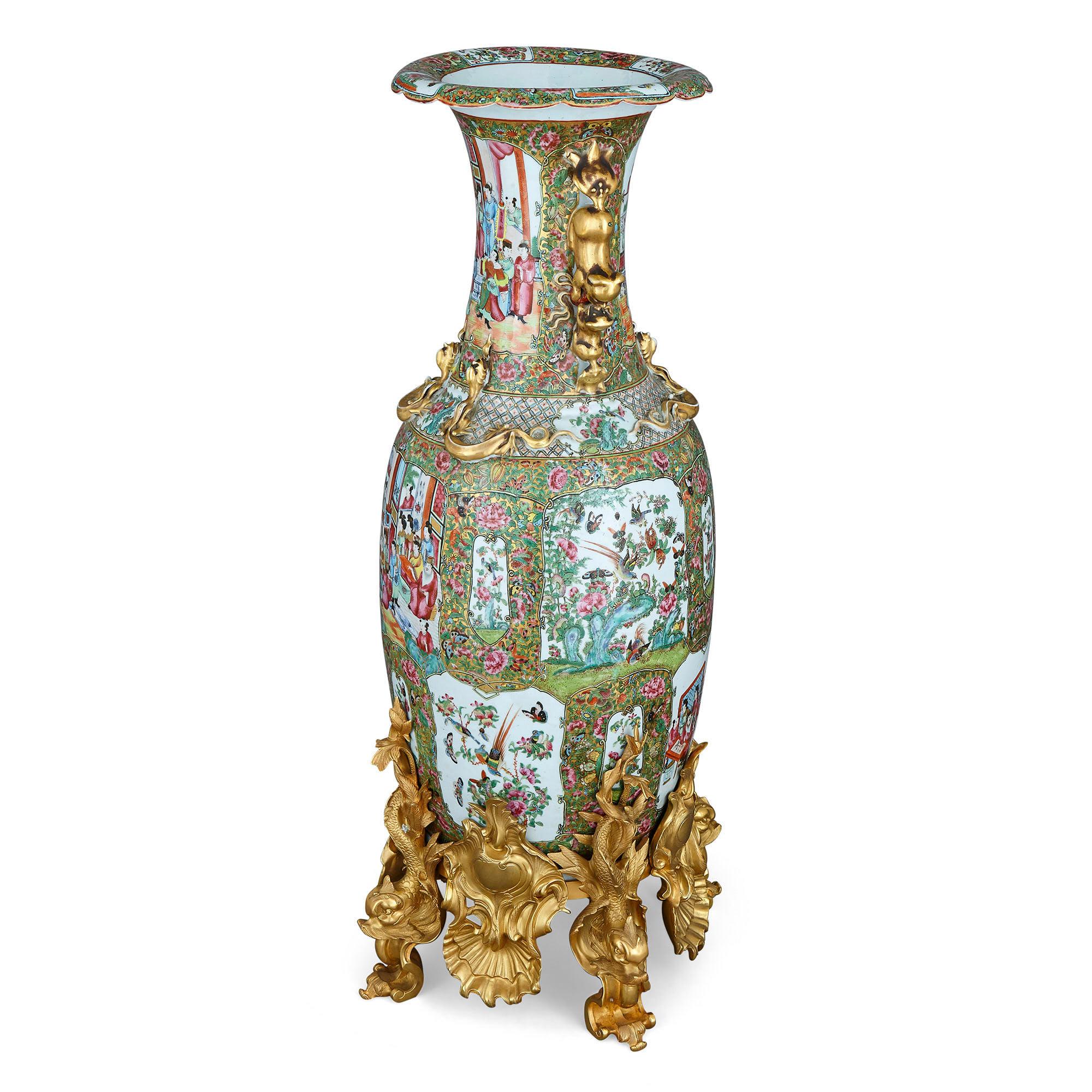 Pair of large Chinese Canton famille verte ormolu mounted porcelain vases
Chinese, 19th century
Measures: height 107cm, diameter 37cm

This magnificent pair of Chinese vases, from the city of Canton, are decorated in the so-called famille verte