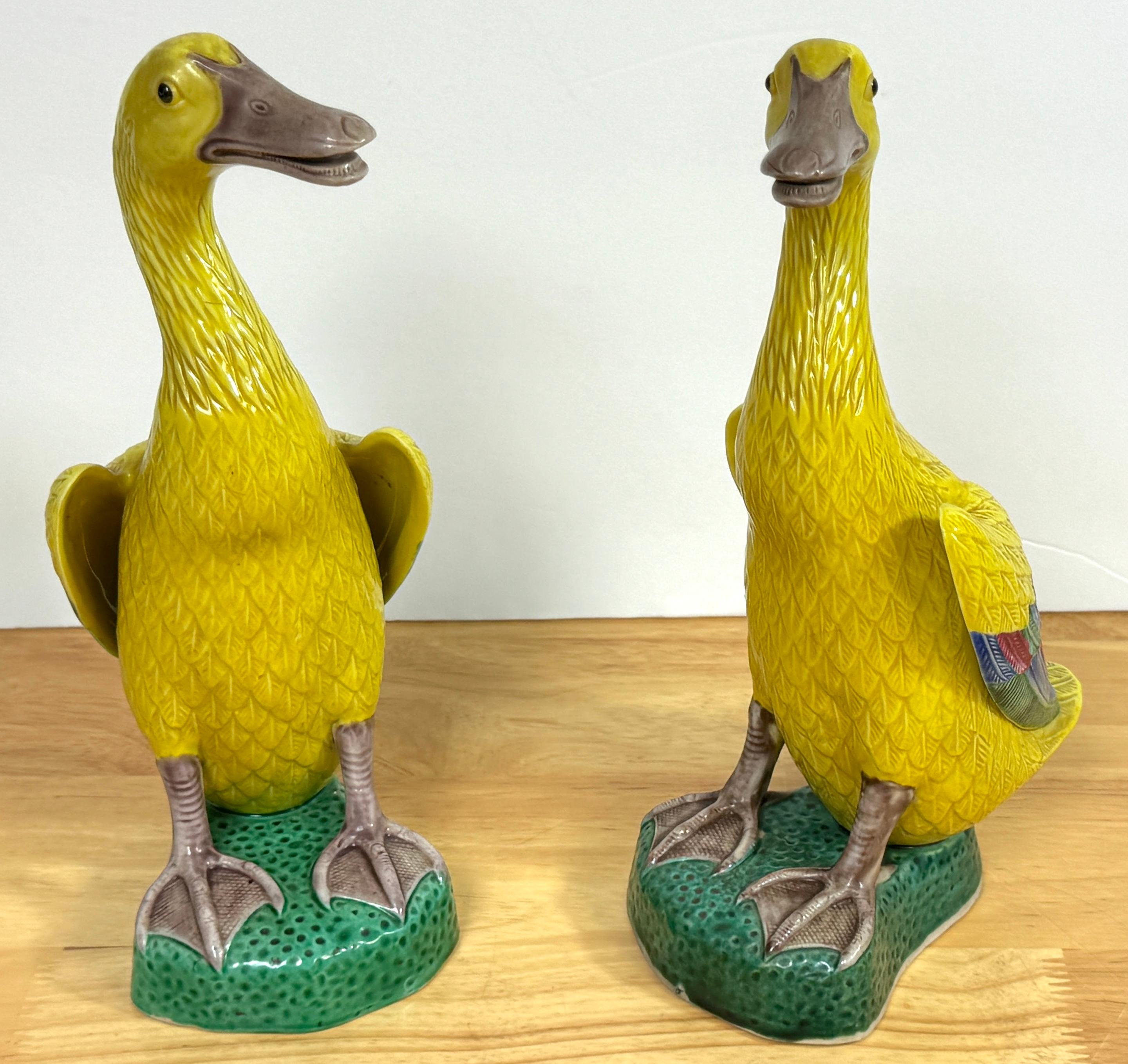 A Pair of Large Chinese Export Porcelain Figures of Yellow Ducks 
China, 20th century 

This pair of large Chinese export porcelain figures of yellow ducks dates to the 20th century. Each duck, standing at an impressive 10 inches high, is modeled