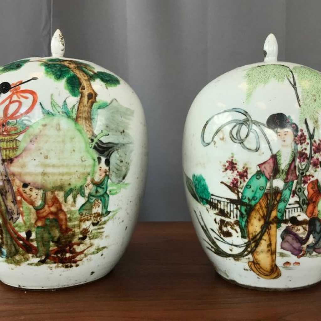 A pair of large Chinese Famille Verte porcelain covered vases or jars from the early republican period. 

Each ovoid form with figural decoration depicting female immortal with auspicious objects. These include children, deer, peach, bat, and