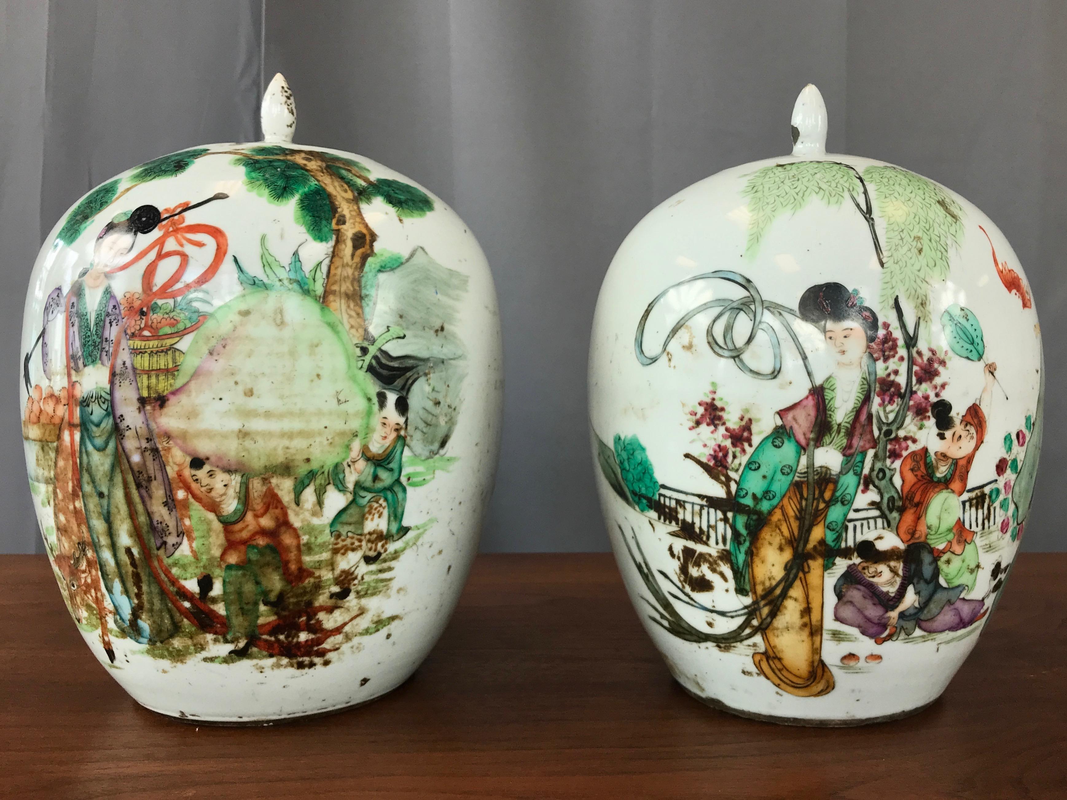 A pair of large Chinese Famille Verte porcelain covered vases or jars from the late Qing period.

Each ovoid form with figural decoration depicting female immortal with auspicious objects. These include children, deer, peach, bat, and banners,
