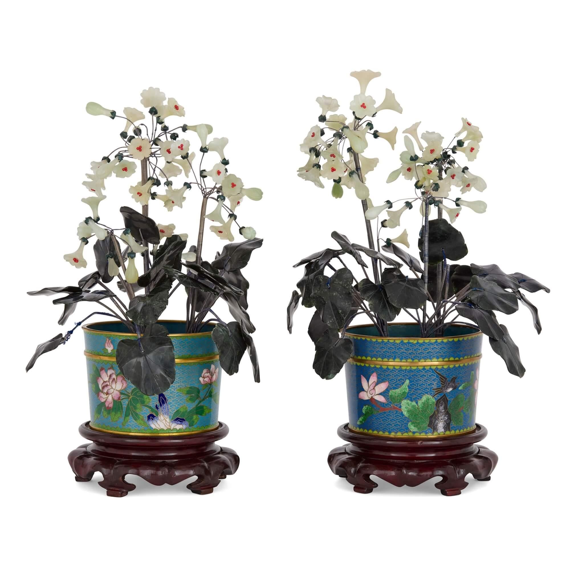 Pair of large Chinese hardstone, jade and cloisonné enamel flower models 
Chinese, 20th Century 
Height 39cm, width 25cm, depth 25cm 

Crafted in 20th century China, this pair of large flower models showcase the centuries-old technique of cloisonné