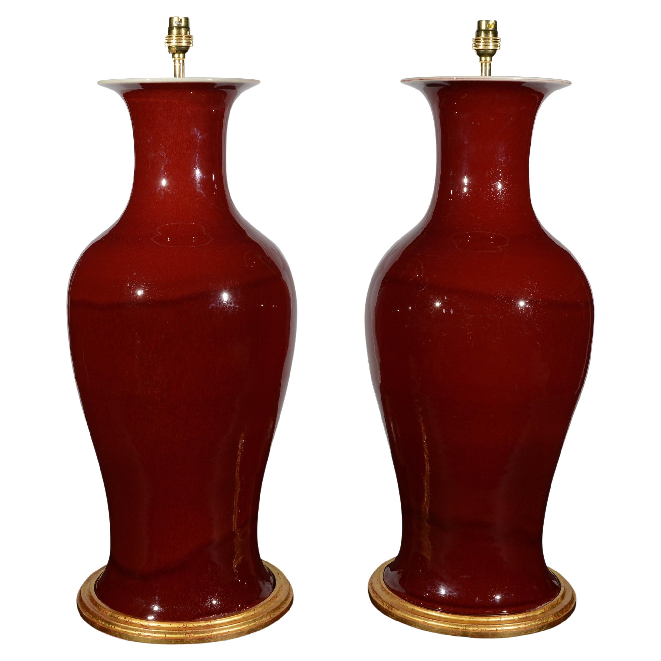 Pair of Large Chinese Sang De Boeuf Baluster Porcelain Table Lamps For Sale