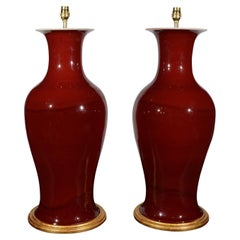 Pair of Large Chinese Sang De Boeuf Baluster Porcelain Table Lamps