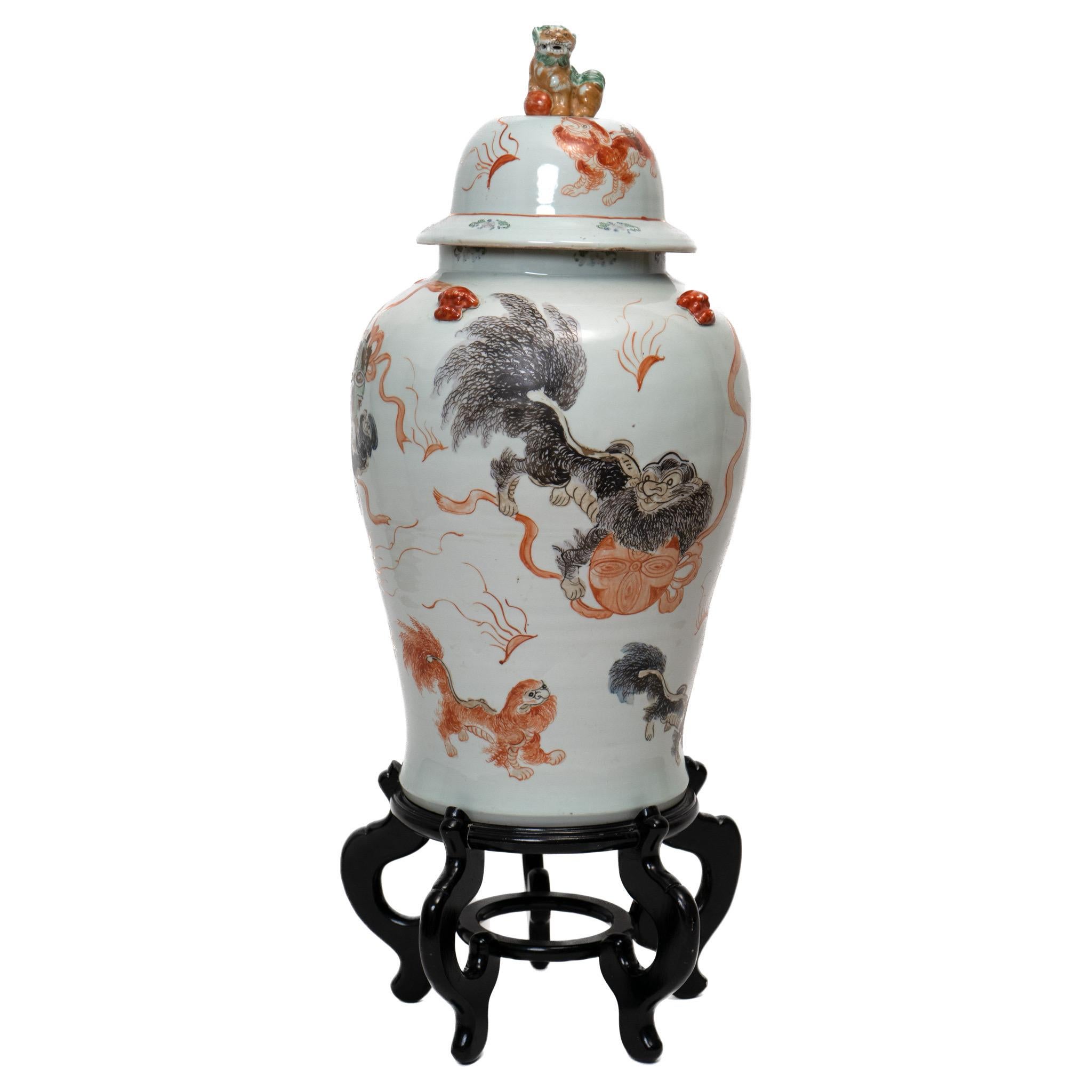 Details of Chinese guardian lions on enamel jars with lids atop pedestals.

18 x 33 in.

$2,450 for the pair