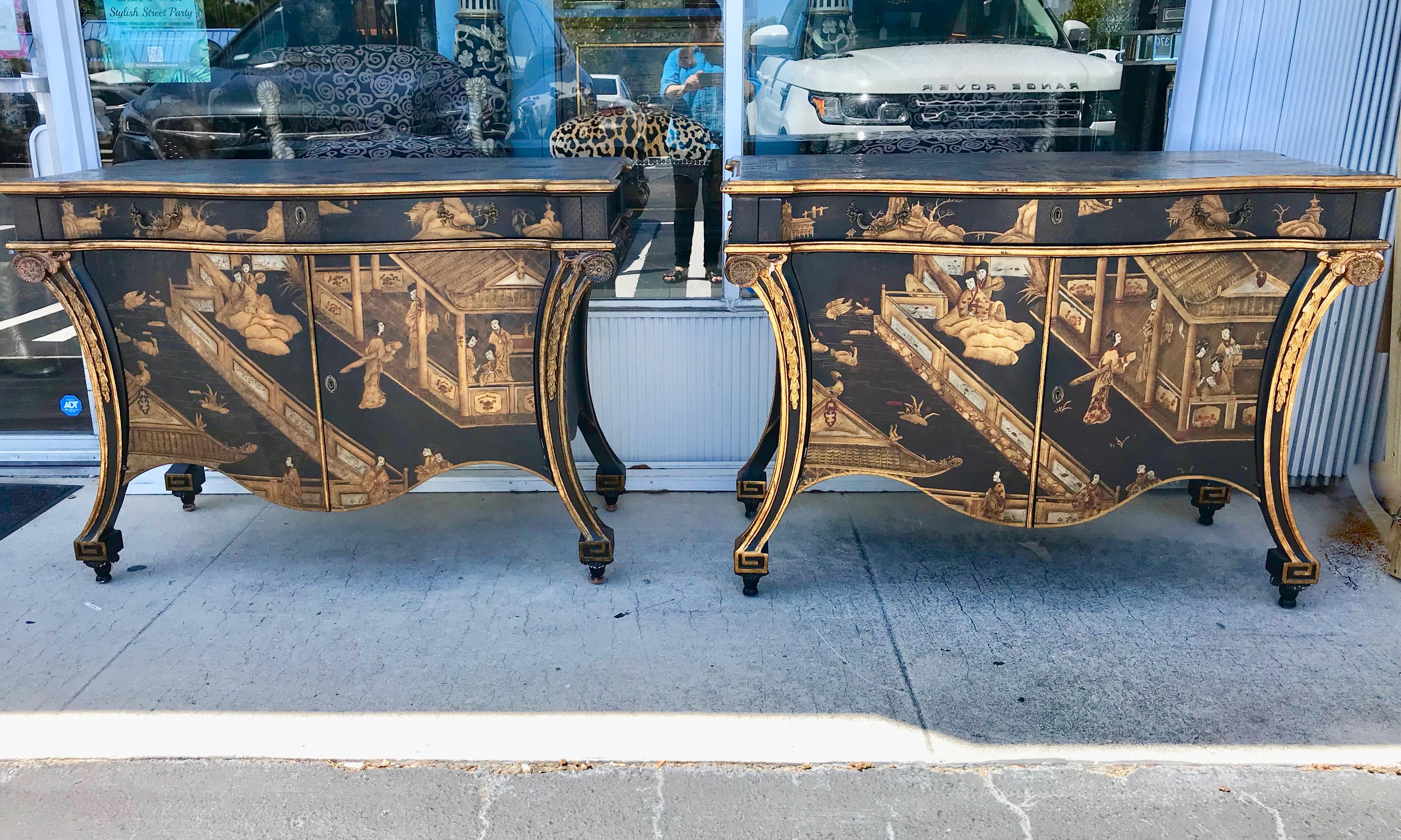A superb pair of Chippendale chinoiserie gold and black lacquer commodes ,
the shaped tops decorated with a scene wildlife and pagodas. The long drawer in the frieze and paneled doors below with deep apron similarly decorated and flanked by Sabre