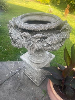 Pair of Large Classical Style Composite Stone Garden Urns on Plinths