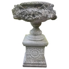 Pair of Large Classical Style Composite Stone Garden Urns on Plinths