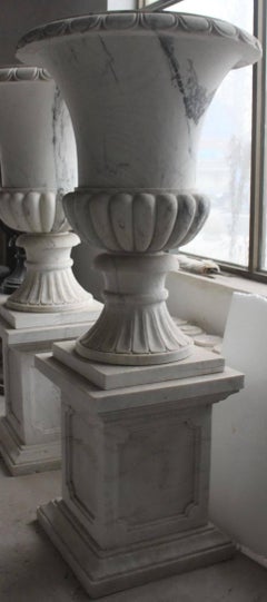Pair of Large Classical Style Marble Urns on Pedestal Stands
