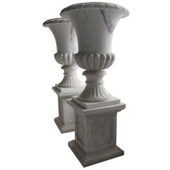 Pair of Large Classical Style Marble Urns on Pedestal Stands