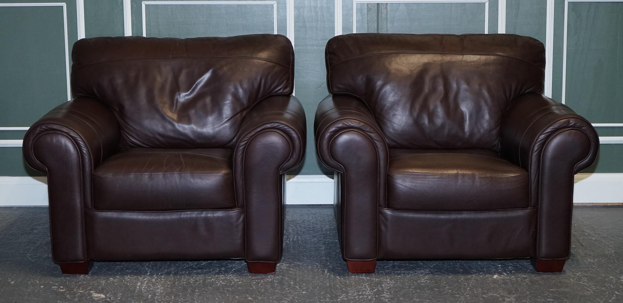 
We are excited to present this pair of large comfortable brown leather armchairs.

A good honest comfortable pair of armchairs.
They are upholstered with cowhide semi-aniline leather which is pre-dyed before upholstery.

The advantage is that the