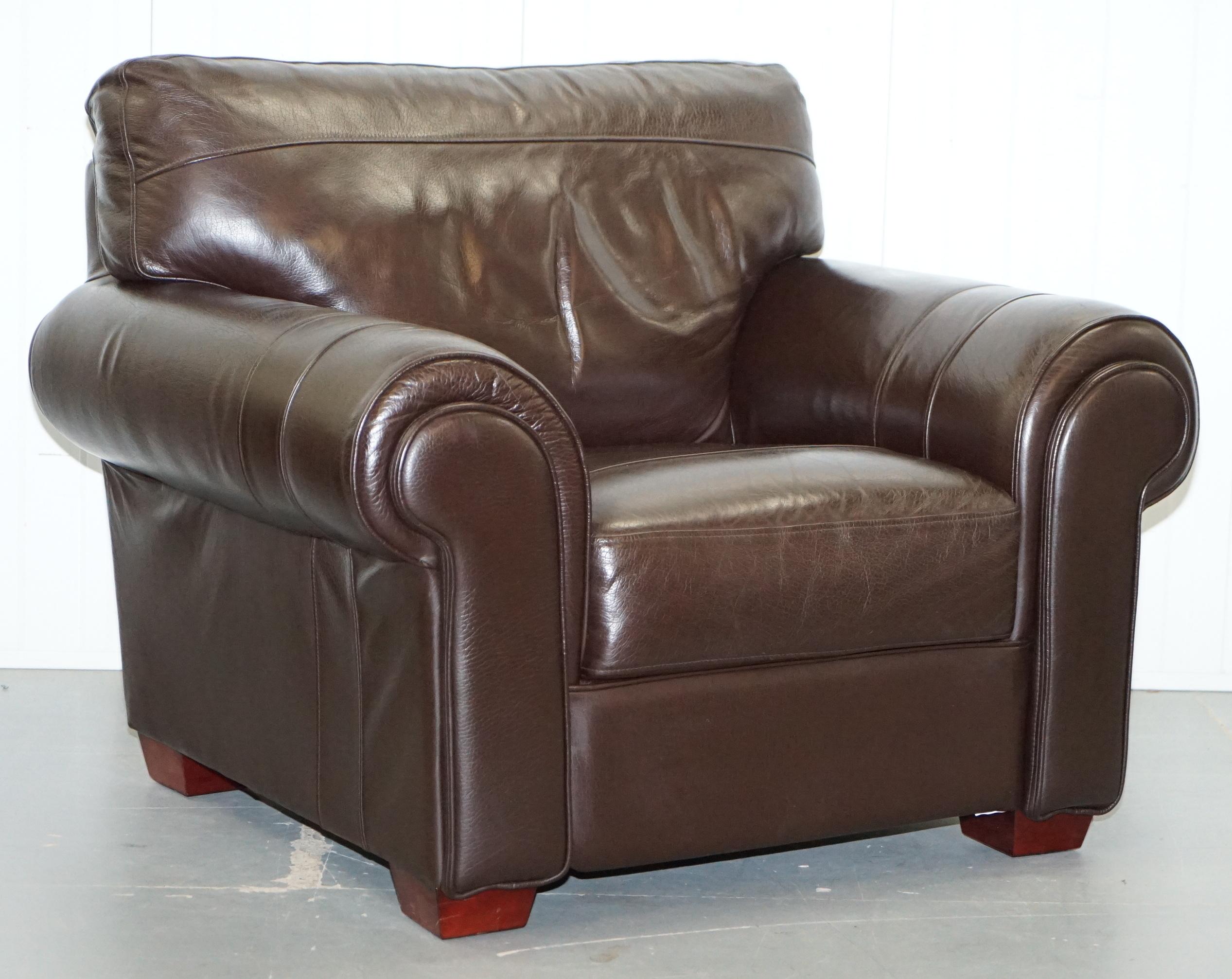 We are delighted to offer for sale this lovely pair of large comfortable solid brown leather armchairs with matching footstool

A good honest comfortable pair of chairs with stool, they are upholstered with cow hide semi aniline leather which is