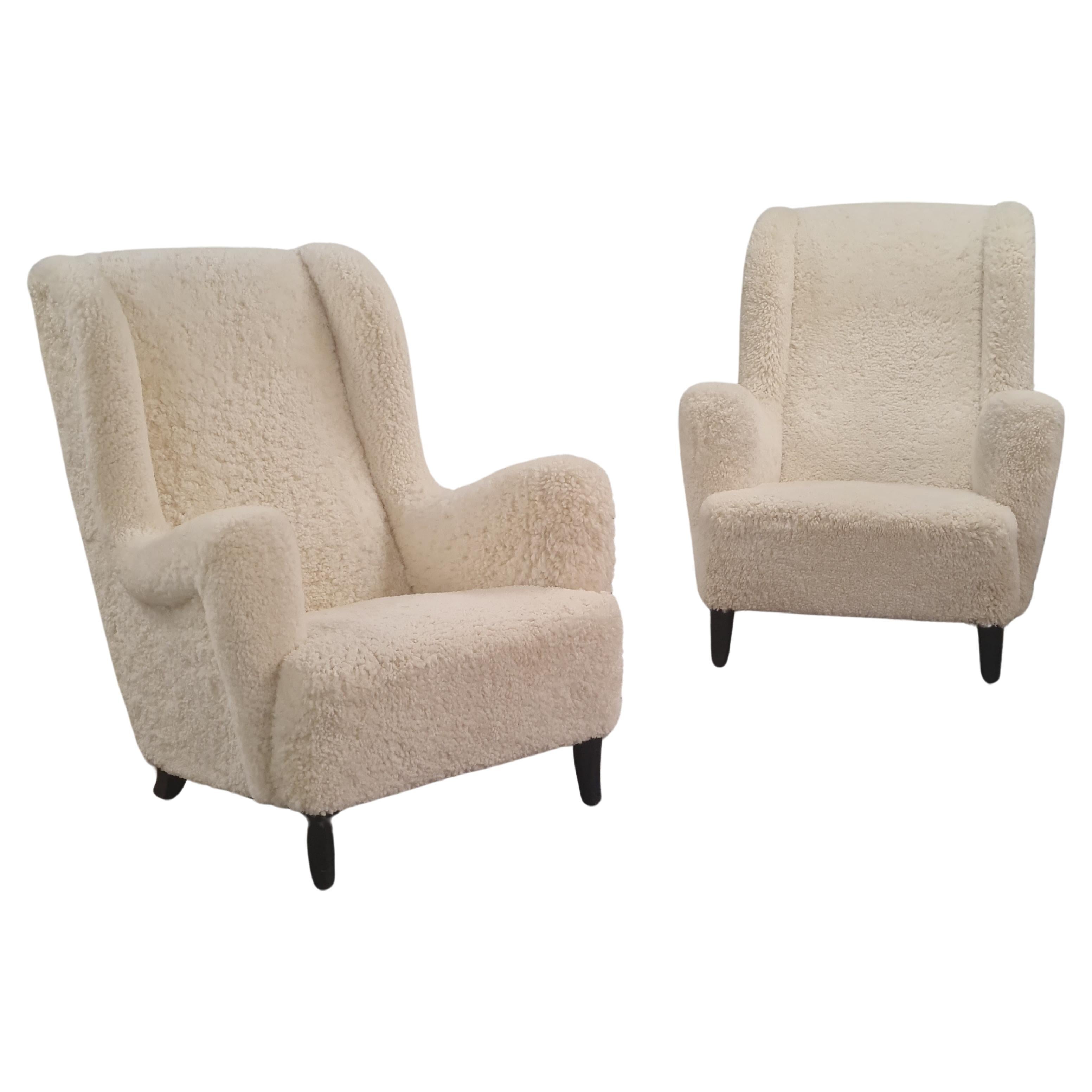 A beautiful and sizable pair of 1940s armchairs. These are heavy weight yet unbelievably comfortable pair of chairs. So comfortable that the decision to put them on sale wasn't an easy one. 
Even though from the 1940s, the chairs have modern sleek